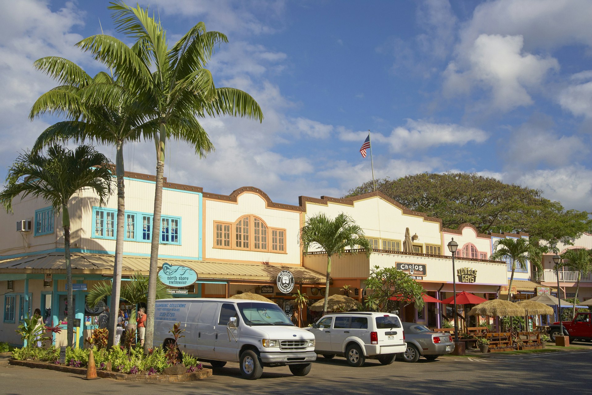 Cars and stores at North Shore Marketplace, Haleiwa 