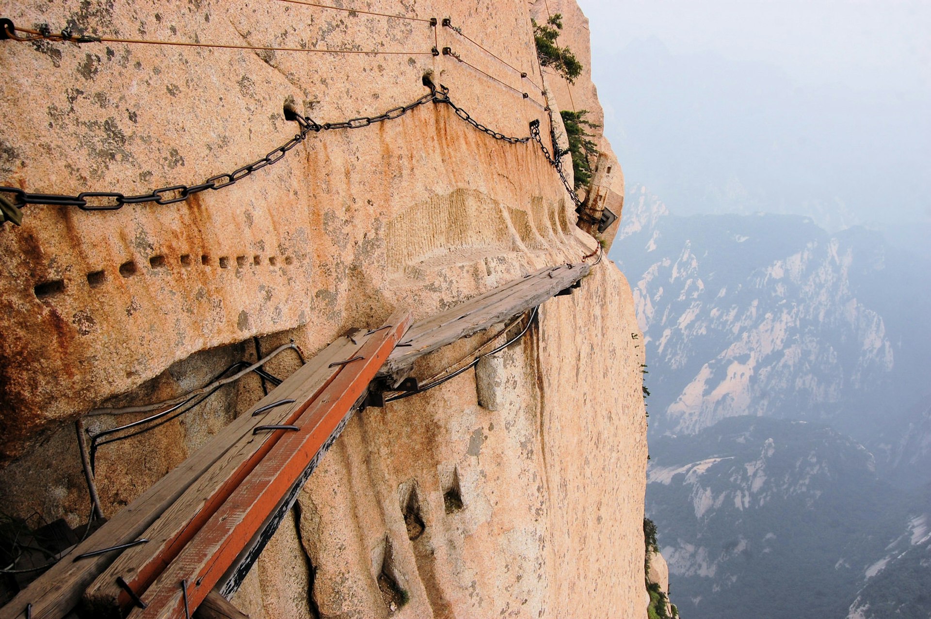 Hike if you dare: rickety plank walkways along Hua Shan's sheer cliff faces © flocu / Getty