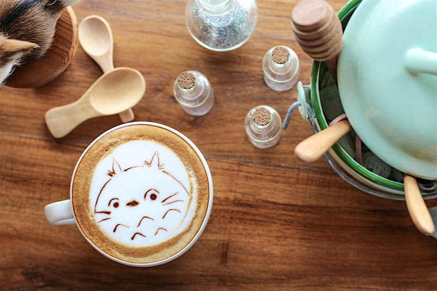 A woodland creature coffee design adorns a cup at Into the Woods in Chiang Mai