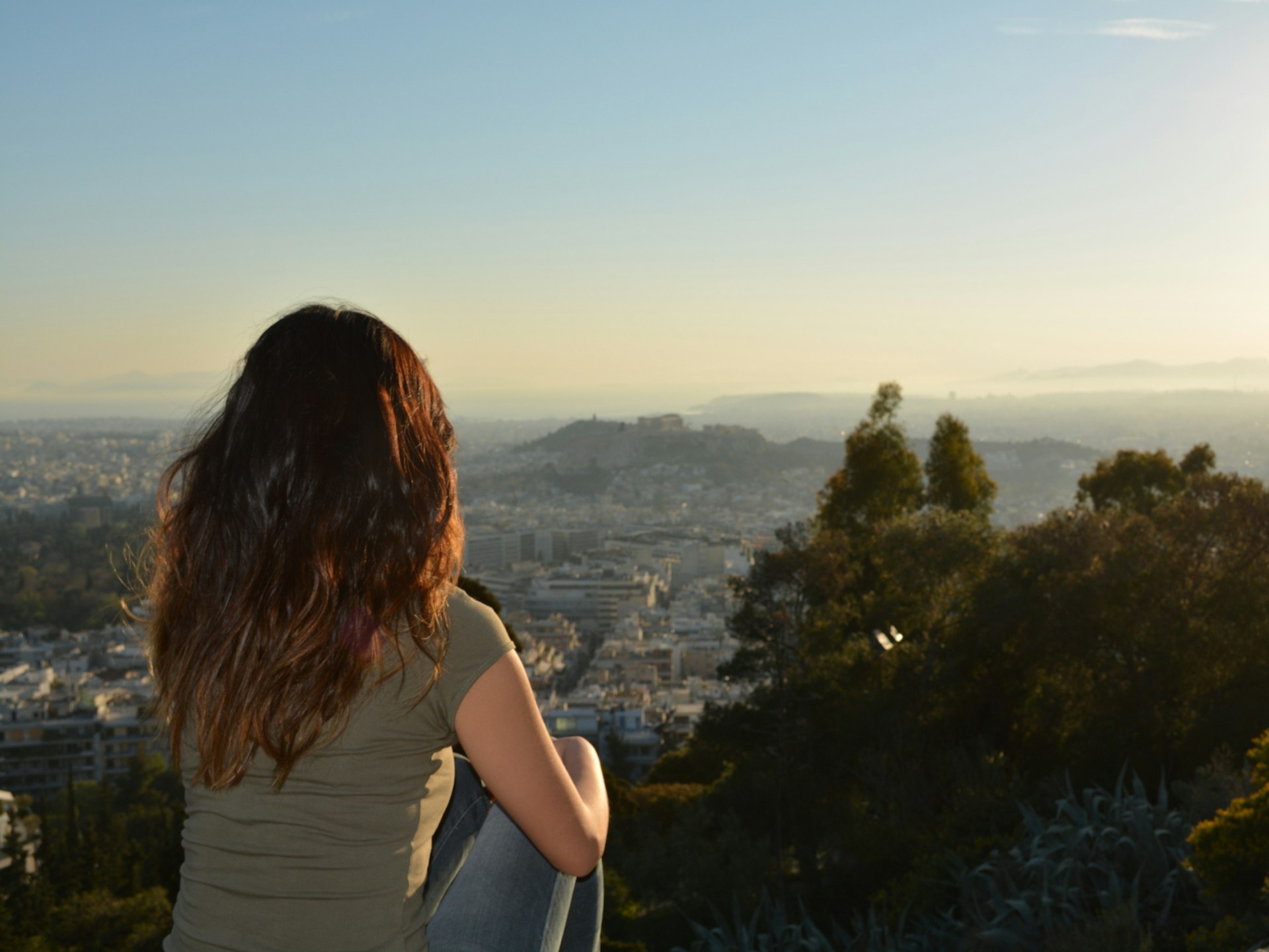 Marissa enjoying the sunset views from the Lycabettus Hill © Marissa Tejada / Lonely Planet