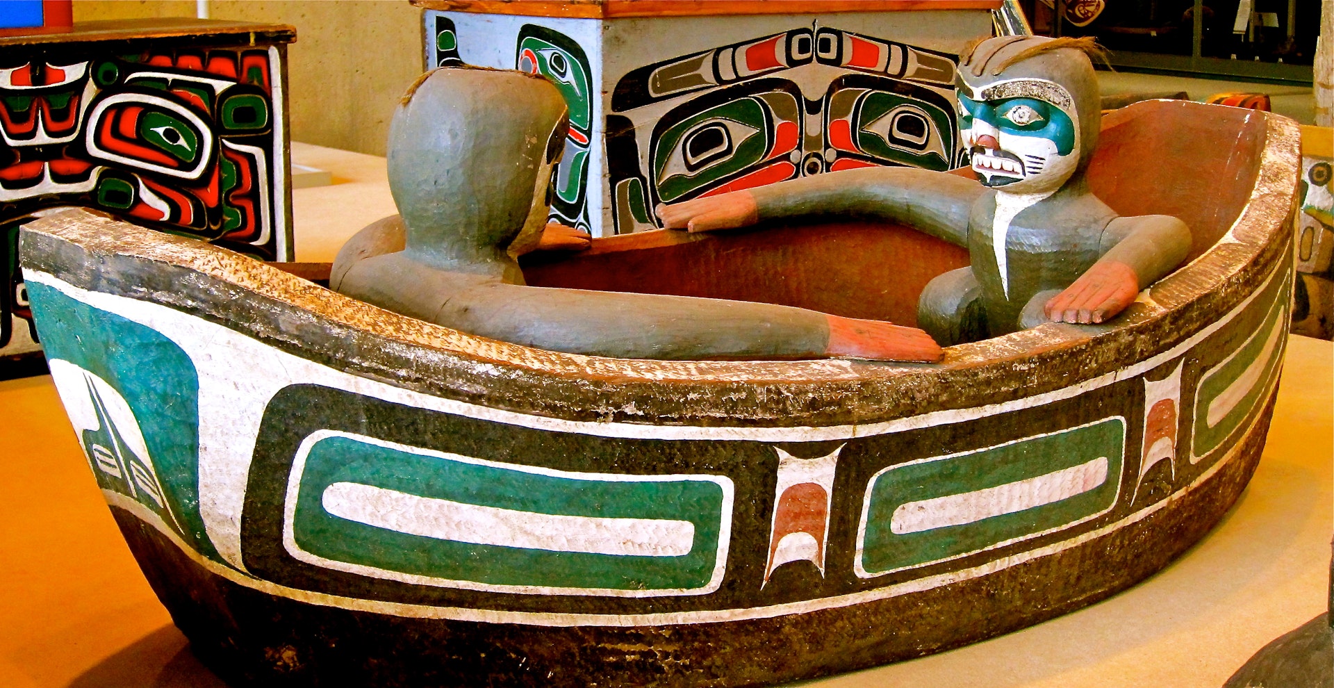First Nations carving of two men in a boat at the Museum of Anthropology in Vancouver.