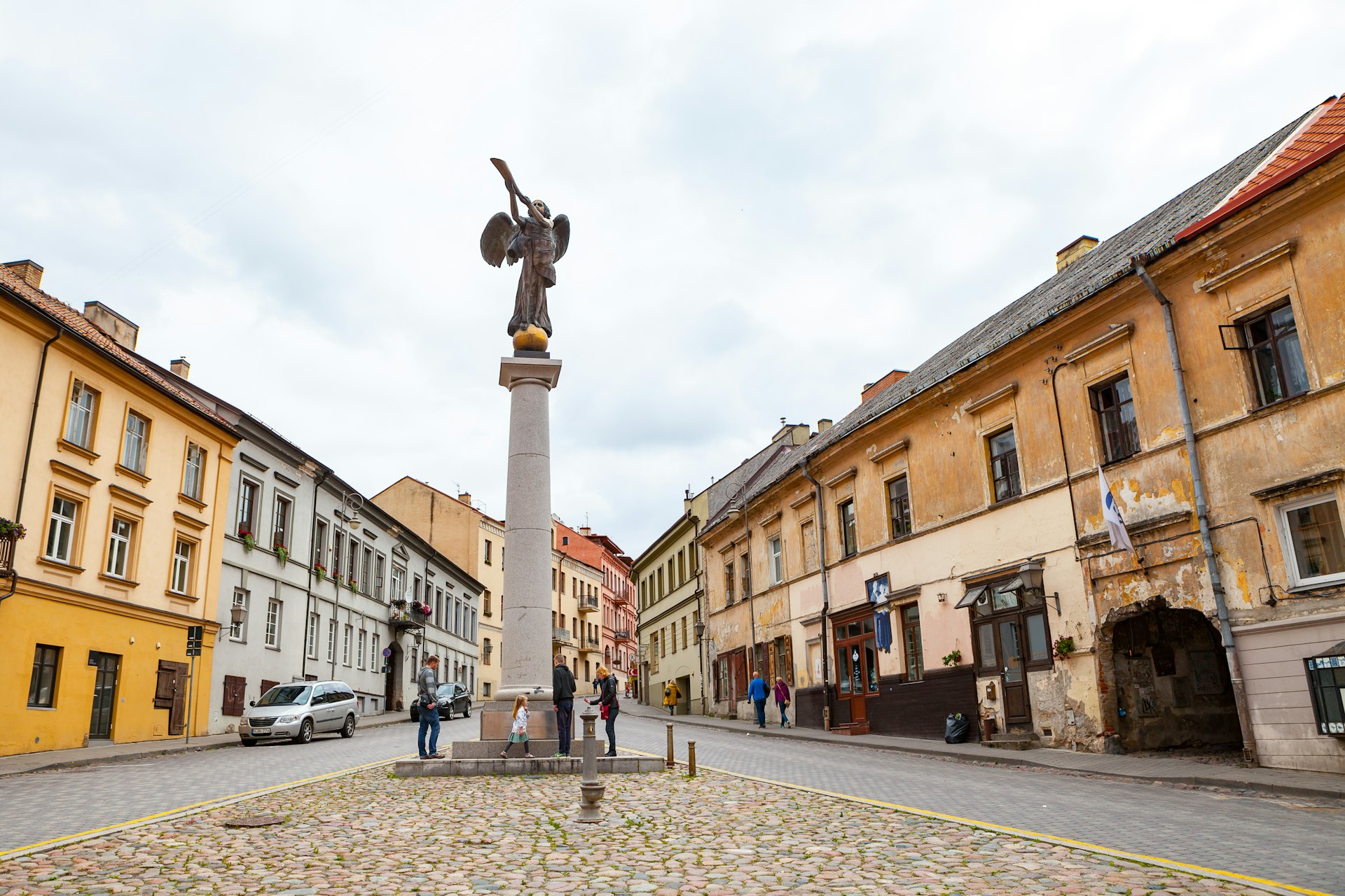 A statue of an angel blowing a trumpet in Užupis