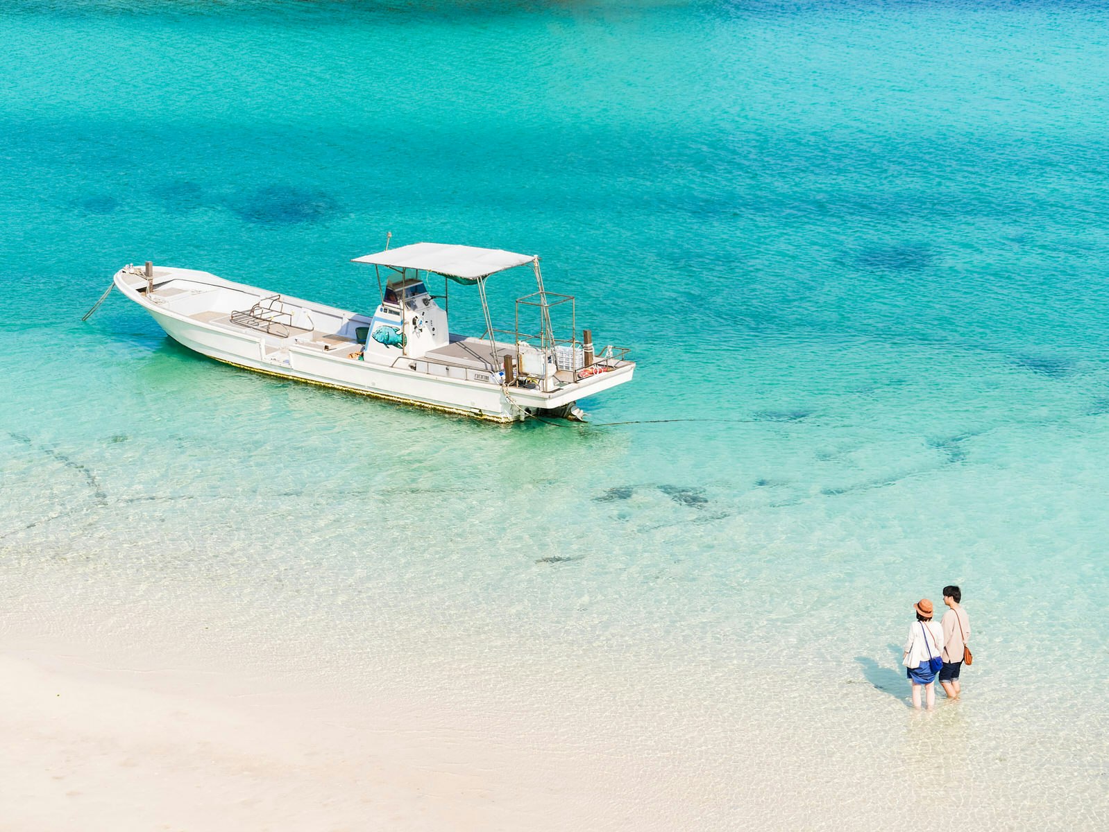 A couple waits for their boat to come in on Ishigaki-jima