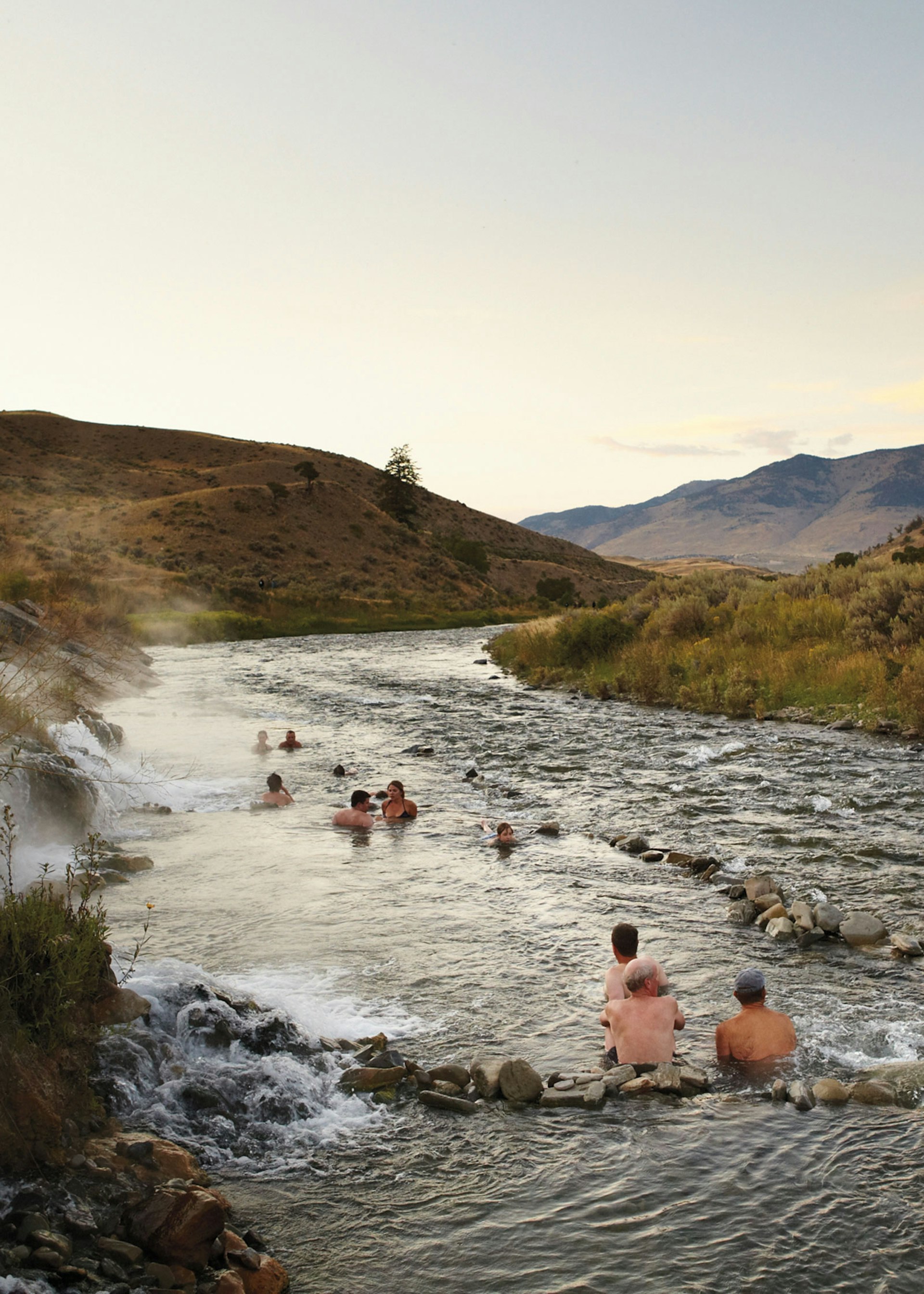 Bathers relaxing in Boiling River, Yellowstone National Park © Matt Munro / Lonely Planet