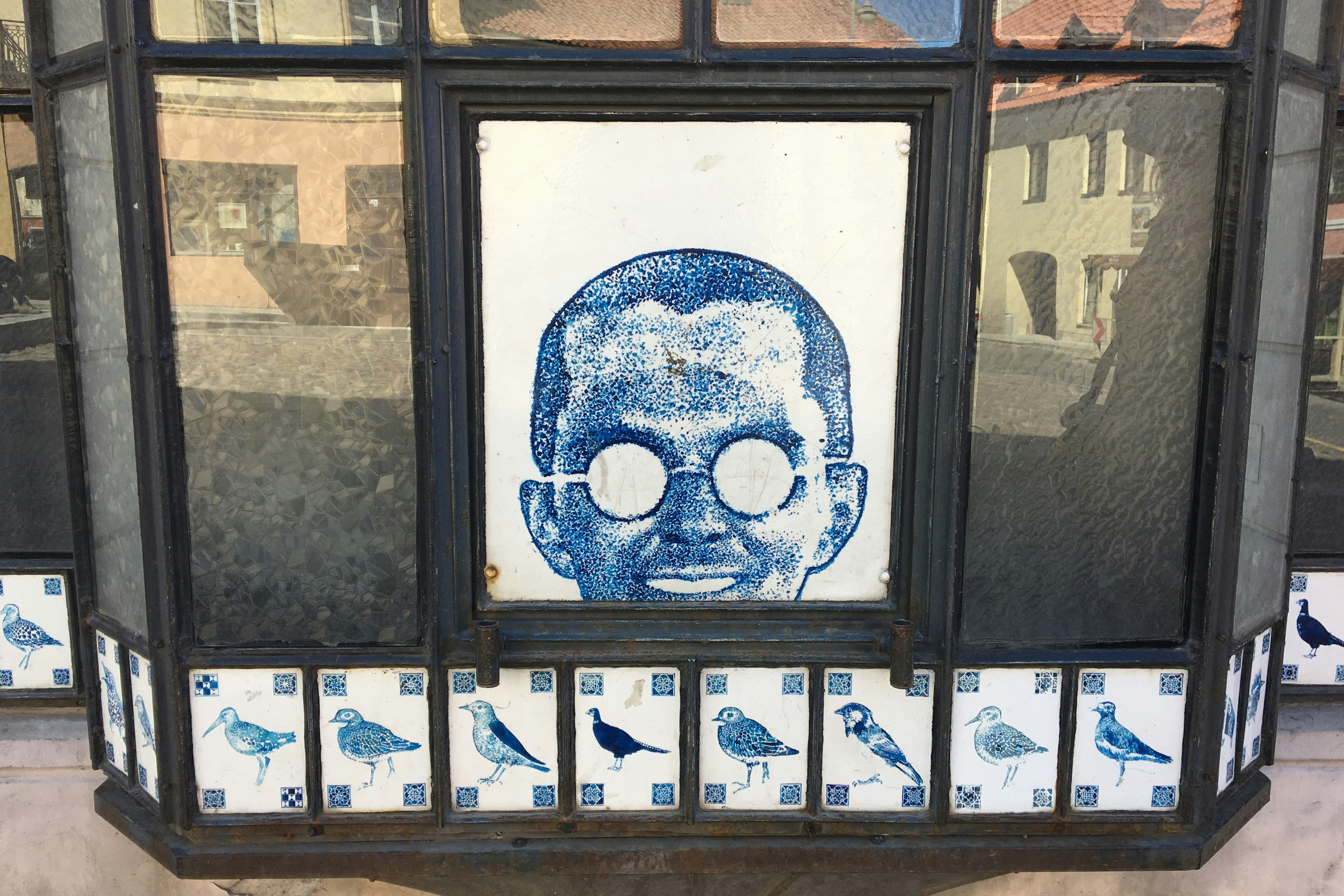 Decorative tiling adorning a bay window in Užupis