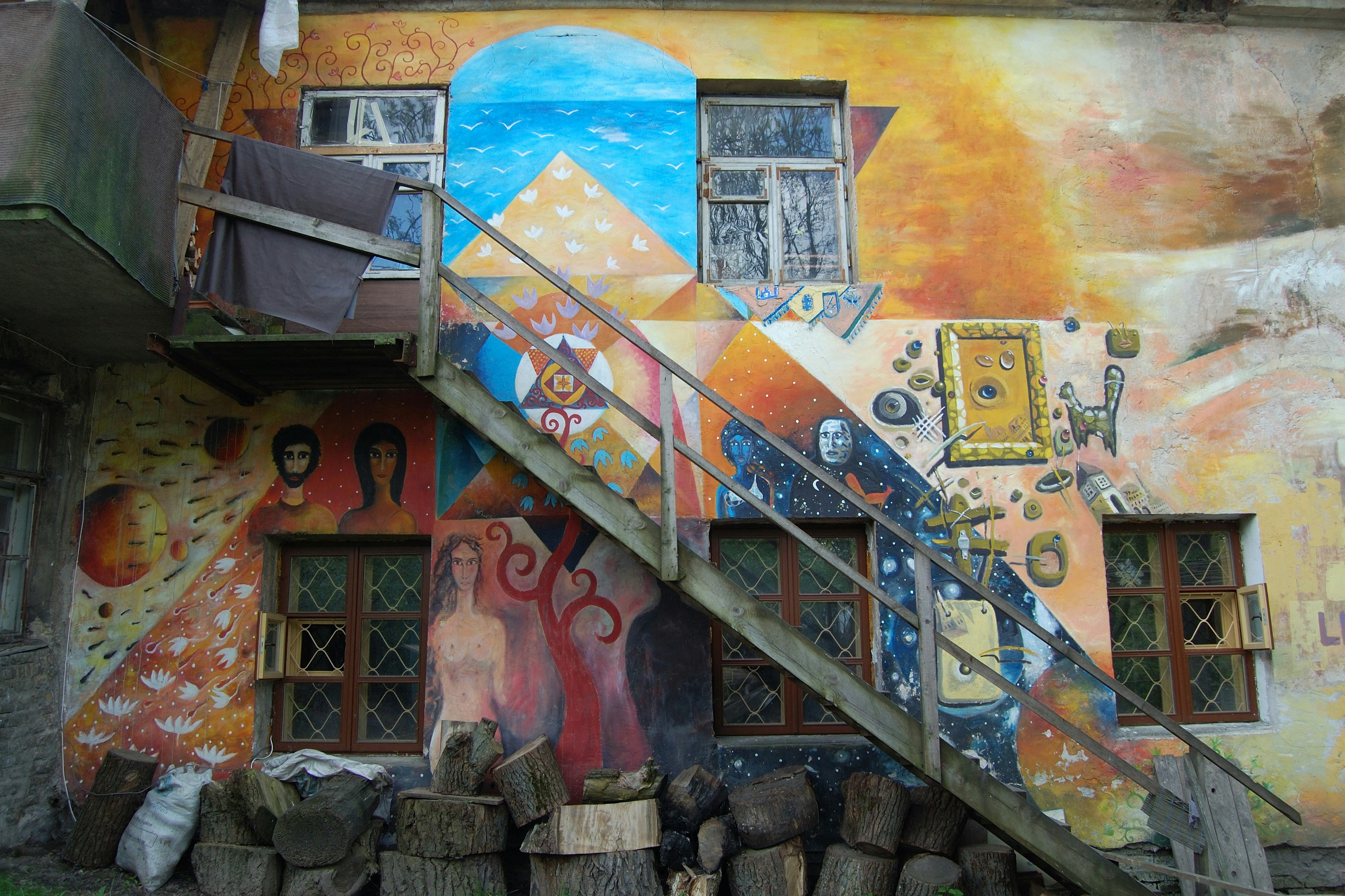 Bright murals adorning the walls of a building in the Užupis district