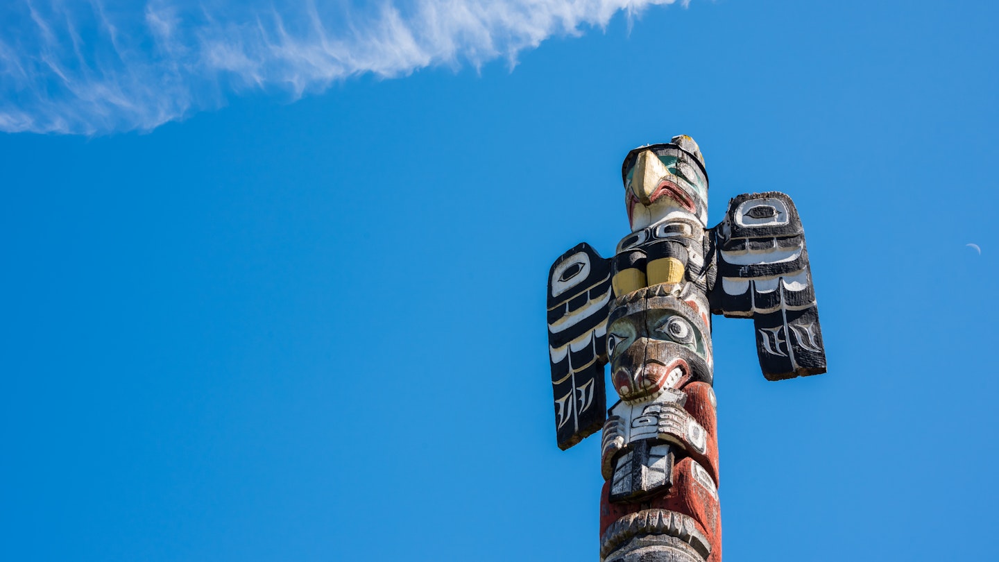 A wood-carved totem pole in Vancouver, Canada