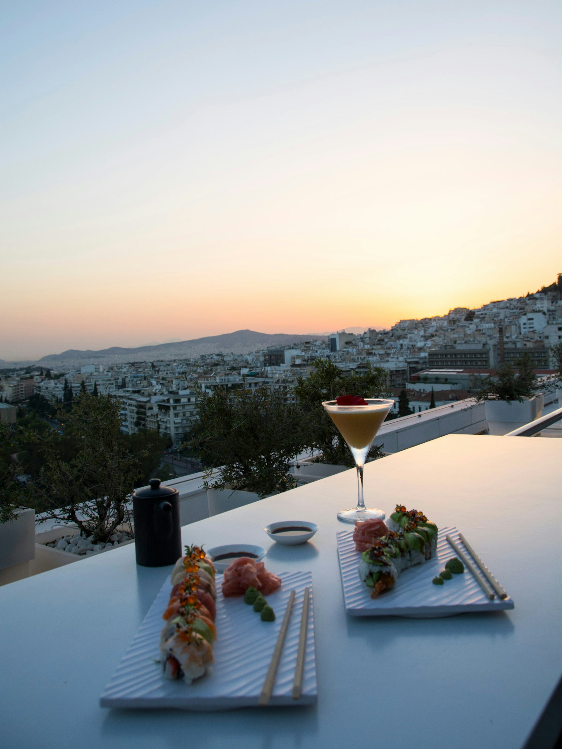 Soaking in the sunset panorama of Athens from Galaxy Bar © Marissa Tejada / Lonely Planet