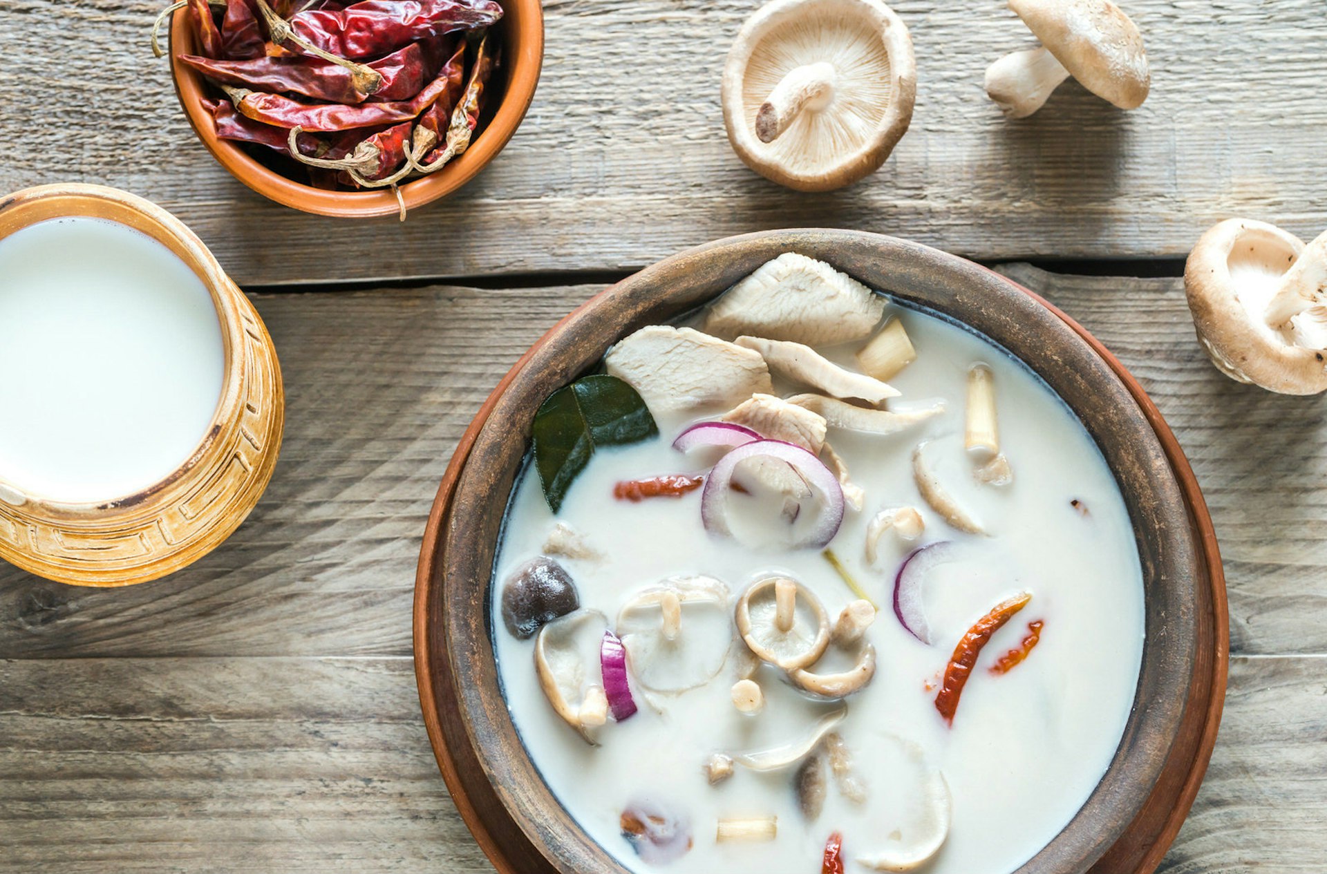 A tabletop shot of Thai coconut soup - bizarrely white, but delicious nevertheless © AlexPro9500 / Getty Images