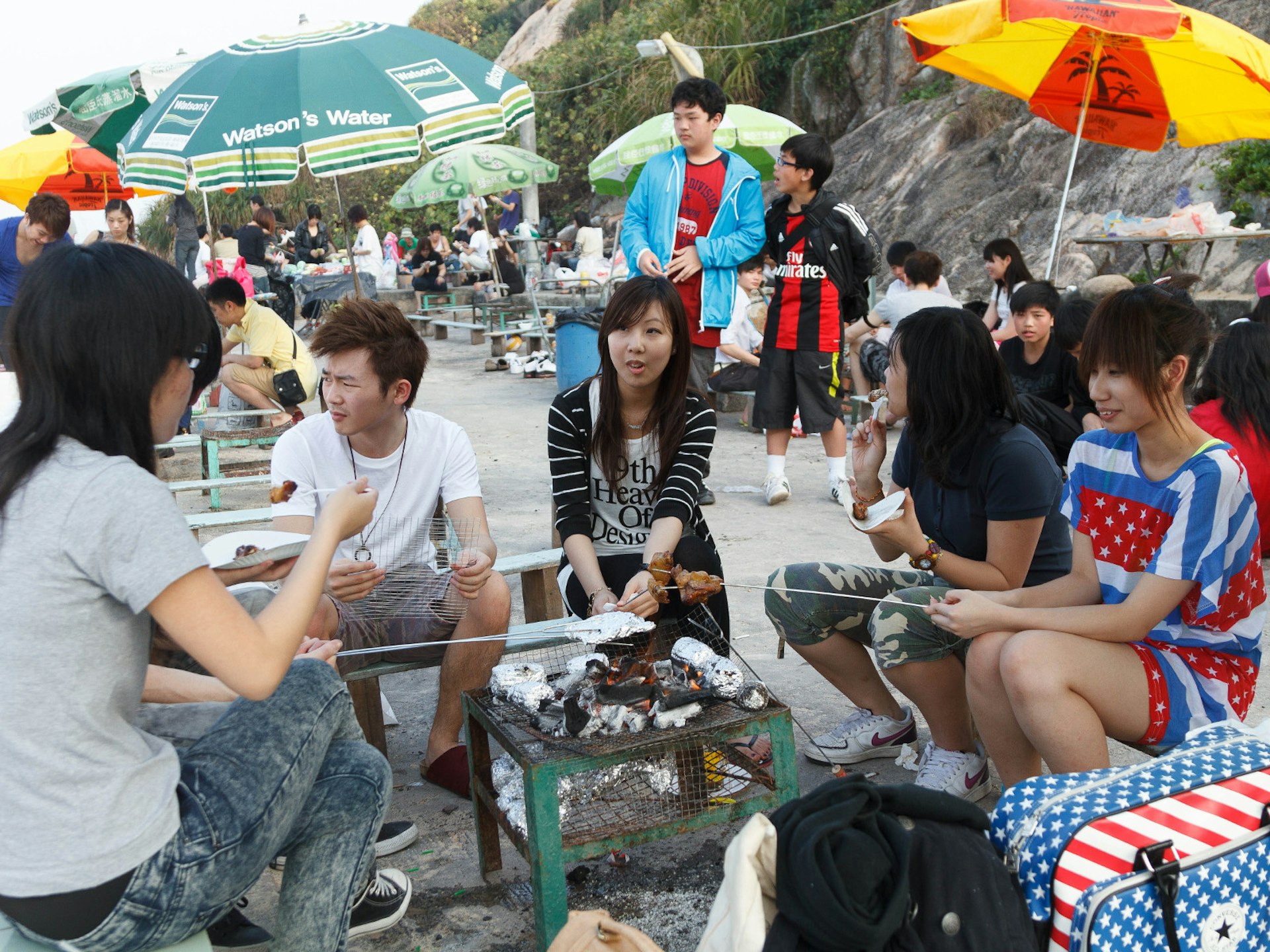 People enjoying a barbecue on Shek O beach, Hong Kong