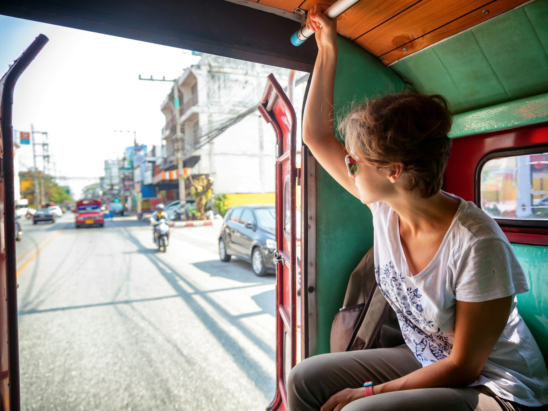 A women riding in Thai public transport