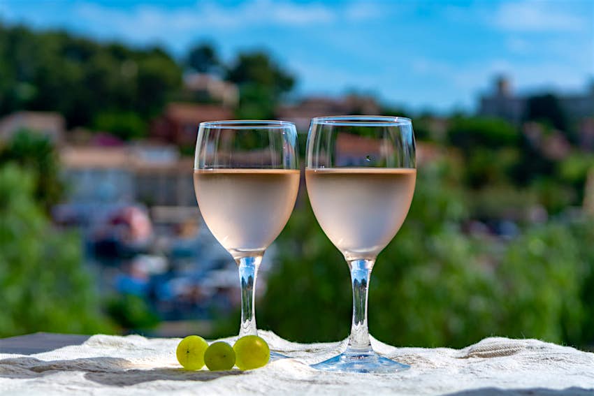 Two glasses of rosé wine served on an outdoor terrace
