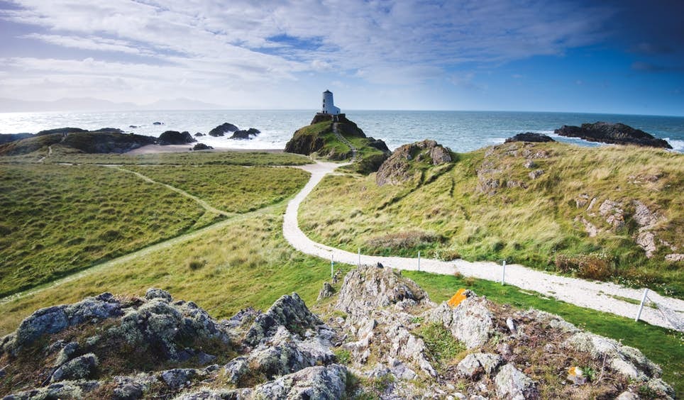 Llanddwyn Island Lighthouse on Anglesey, which contains some of the most spectacular coastline in North Wales © Ray Wise / Getty Images