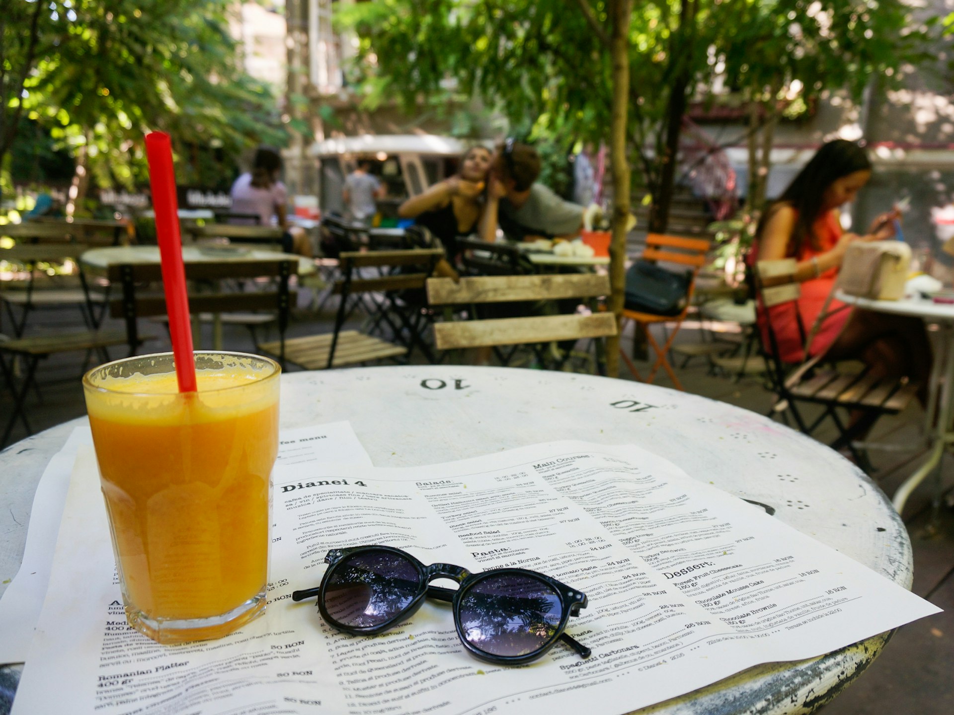Chilling out at Dinaei 4, one of Bucharest's bohemian garden bars © Monica Suma / Lonely Planet