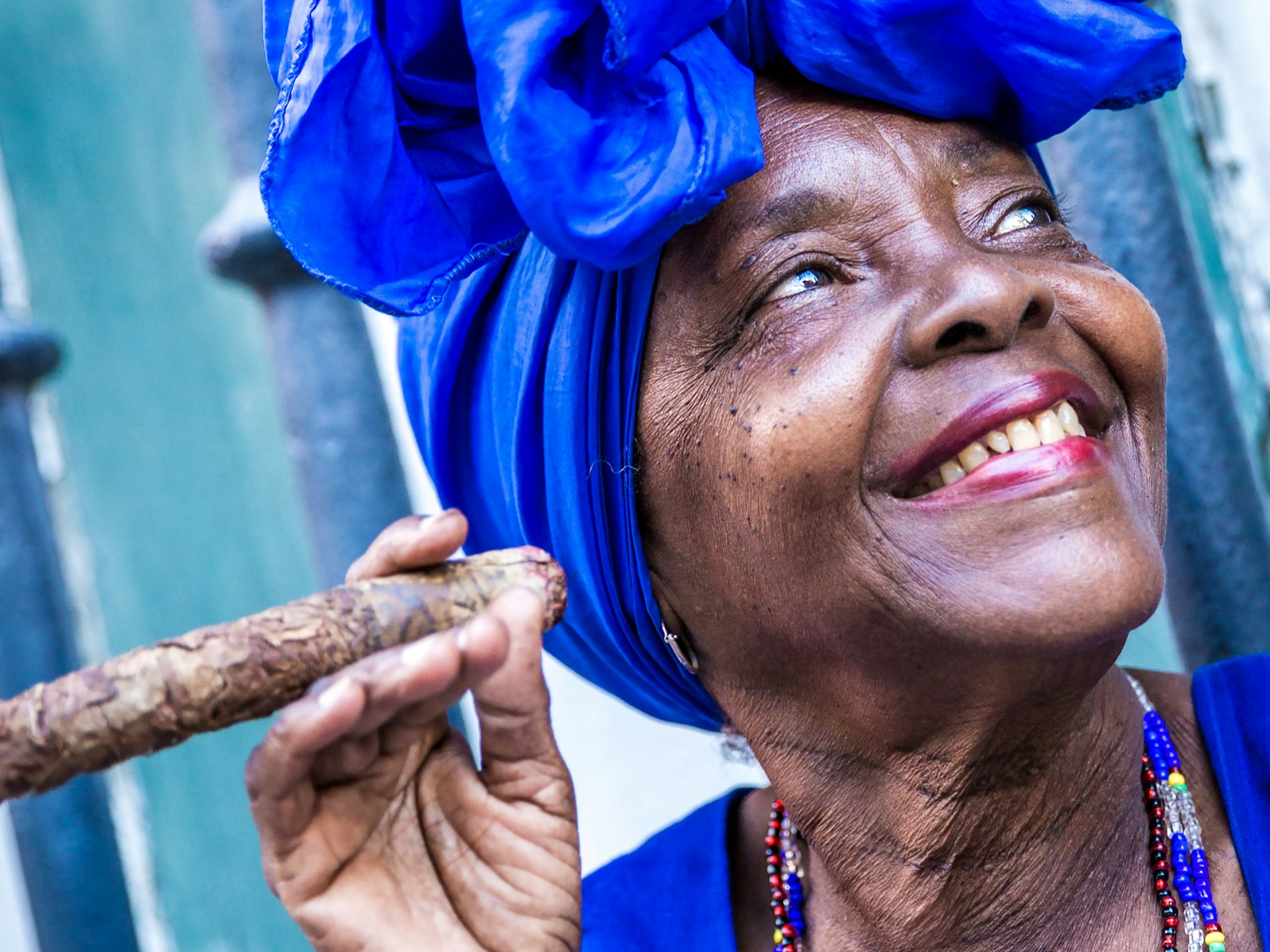 Local smoking a Cuban cigar on the streets of Havana © ESB Professional / Shutterstock