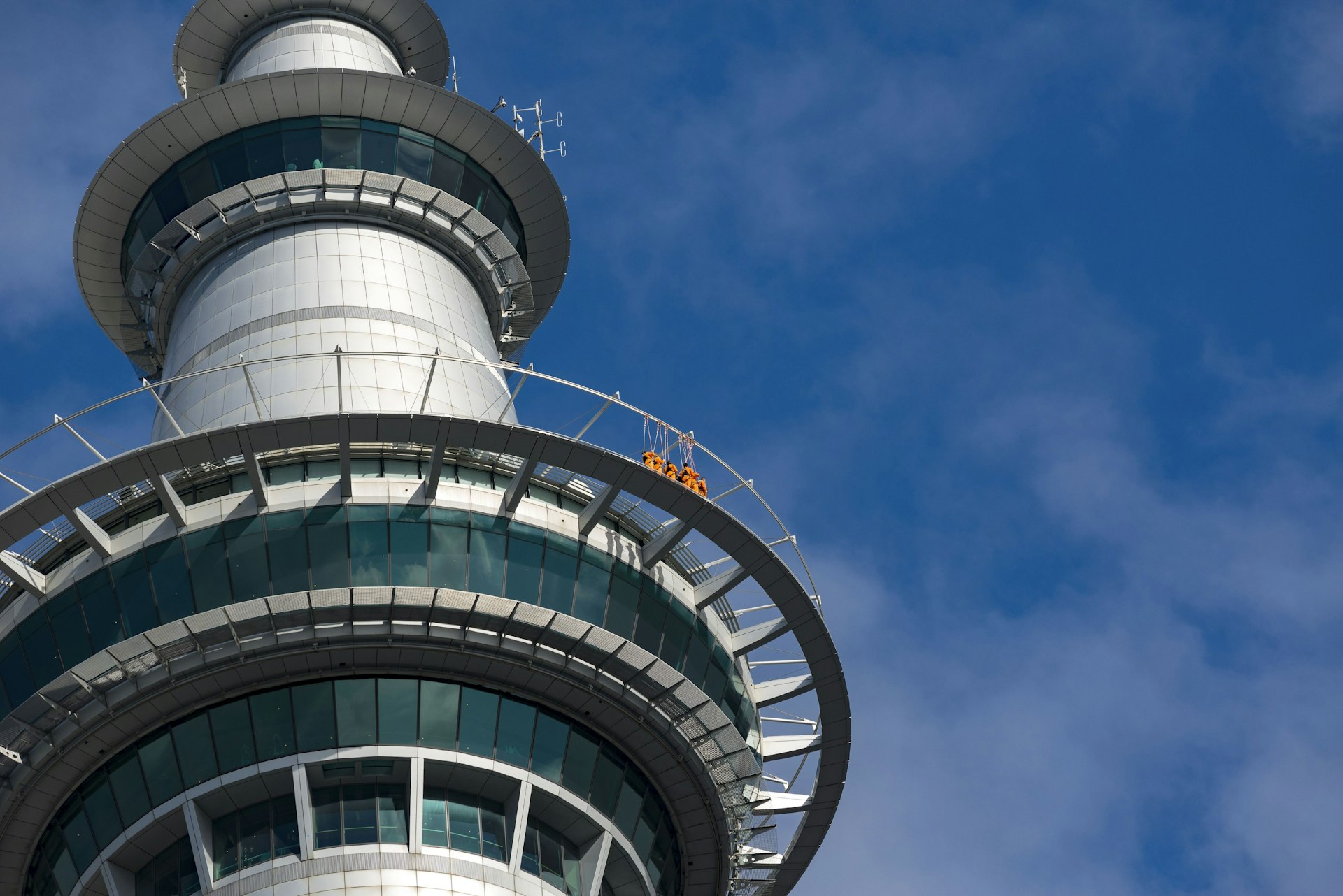 A group of people make their way around the walkway of the Sky Tower, Auckland, New Zealand © Bob Henry / UIG