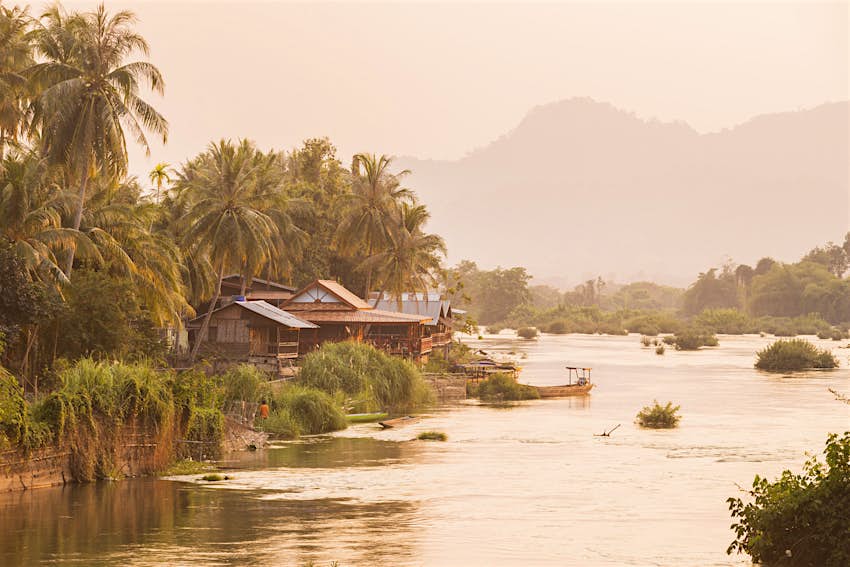 Features - 4000 Islands, Laos The sun sets over the Mekong beside the island of Don Khon, in the Four Thousand Islands