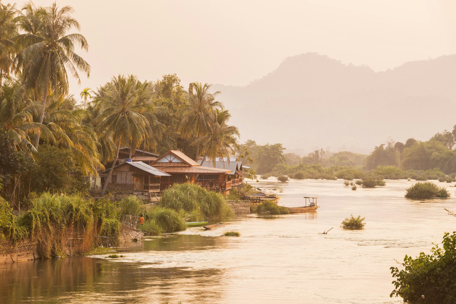 The sun sets over the Mekong beside the island of Don Khon, in the Four Thousand Islands
