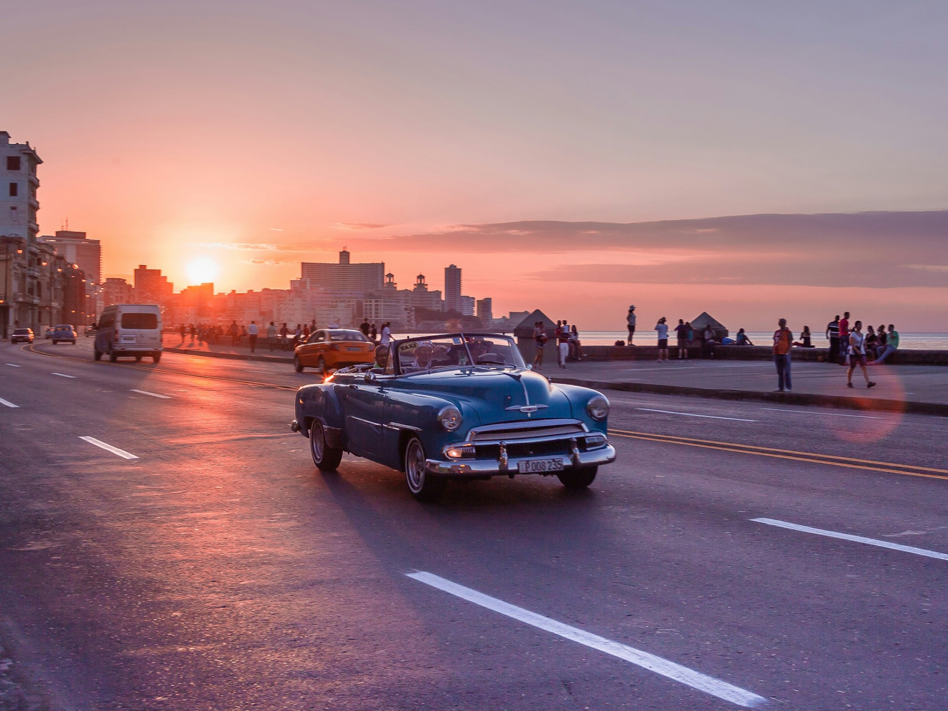 Driving the Malecon at sunset, Havana © Agota Kadar / Shutterstock