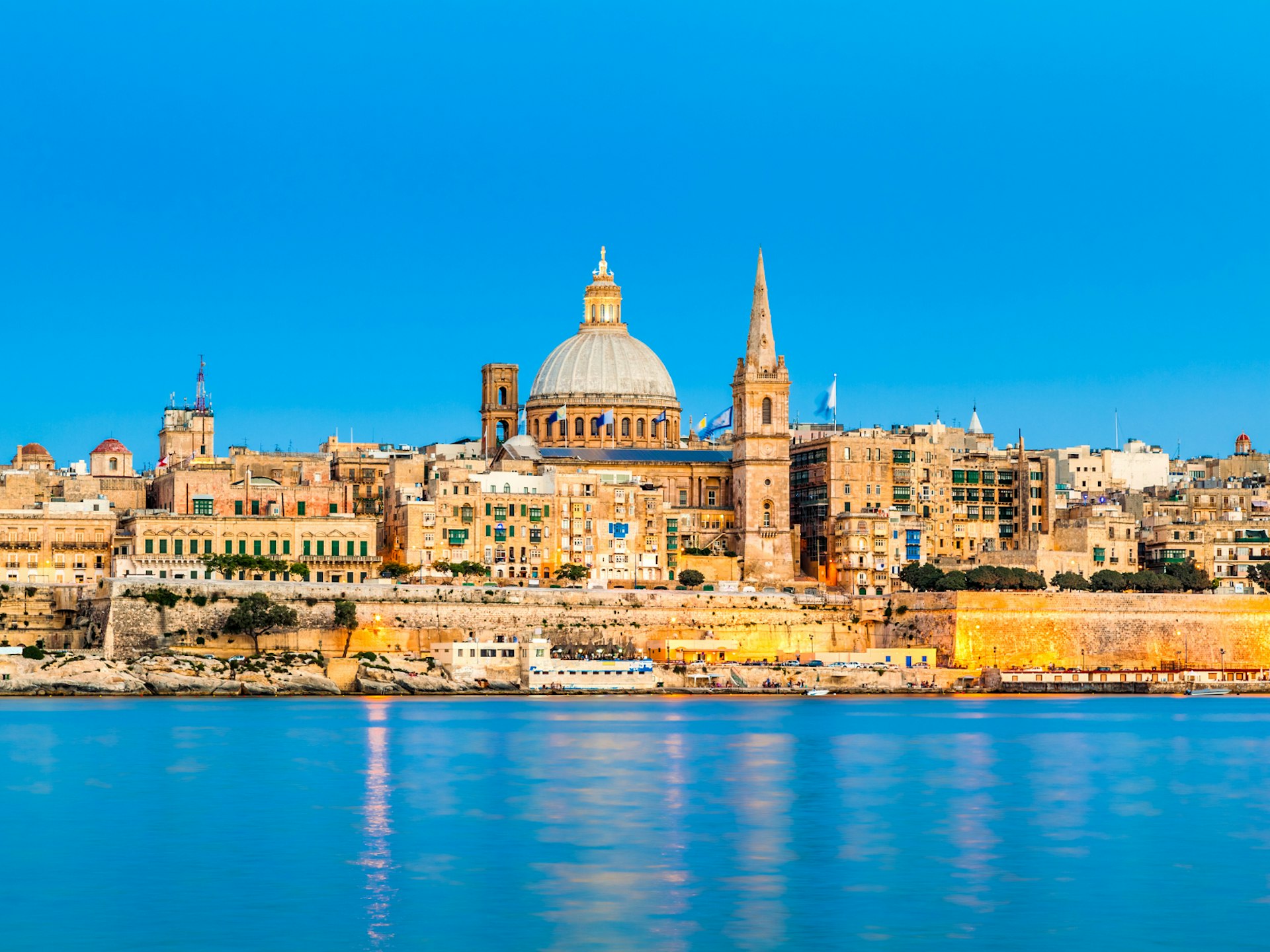 The skyline of Malta's capital city glows golden in the winter sunlight 