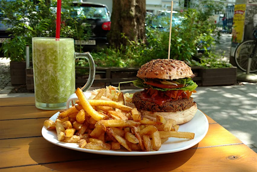 Best vegan Berlin - a huge vegan burger and chips with a lovely green smoothie