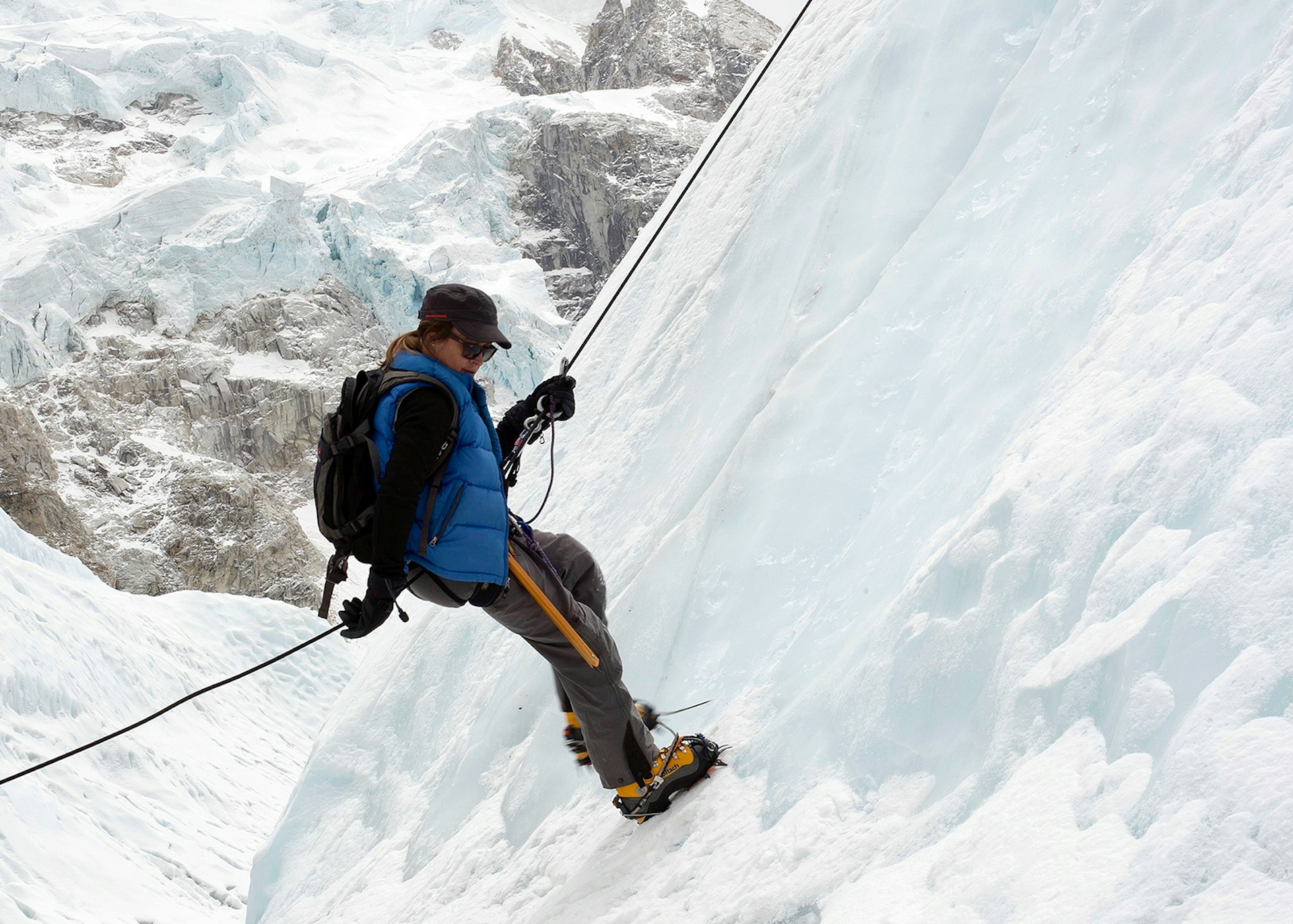 Jennifer Peedom descending by rope down the ice-covered flank of a mountain © Jennifer Peedom