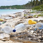Features - Ocean Dumping - Total pollution on a Tropical beach