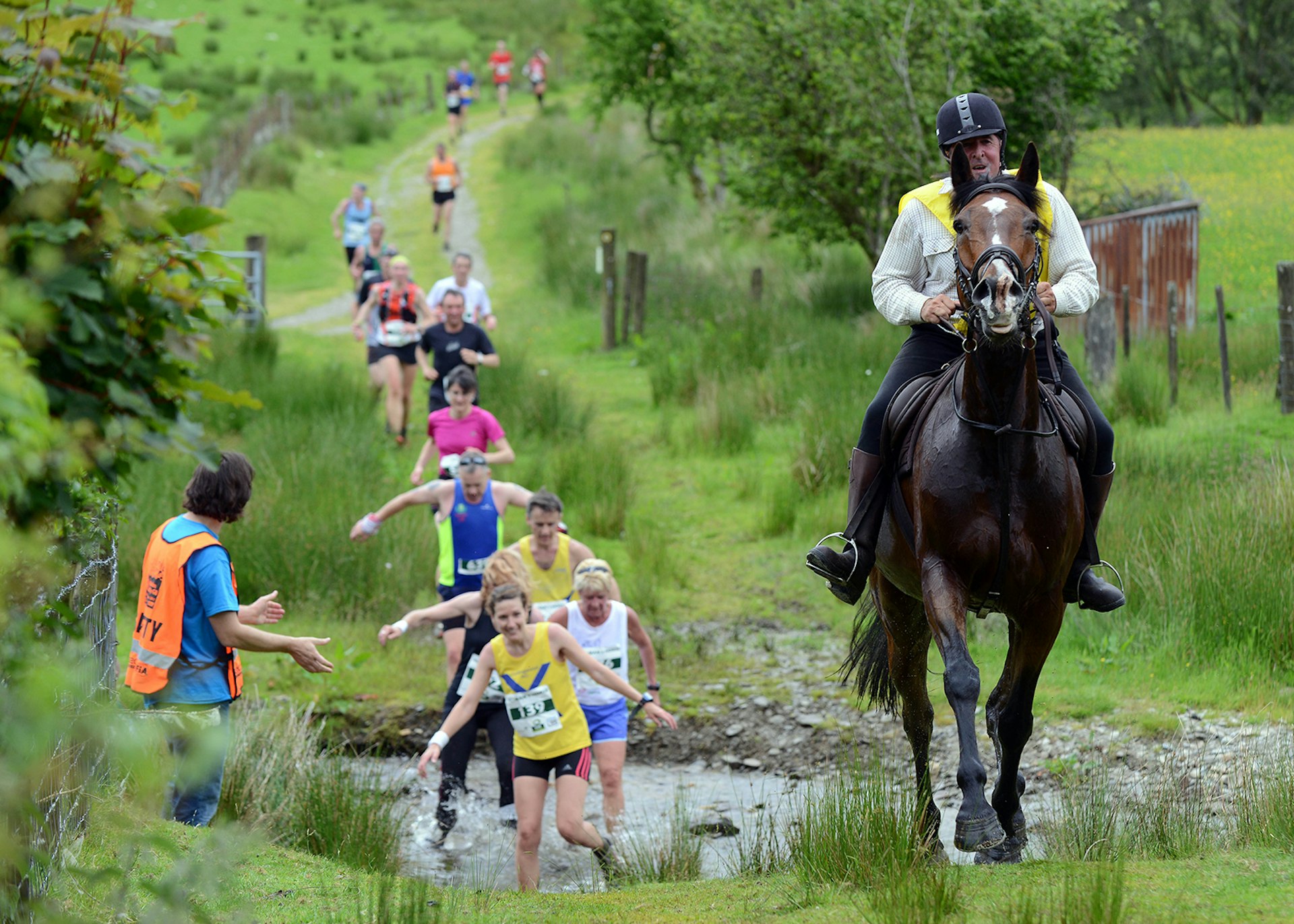 Runners race riders in the Whole Earth Man v Horse Marathon, Wales © Getty Images