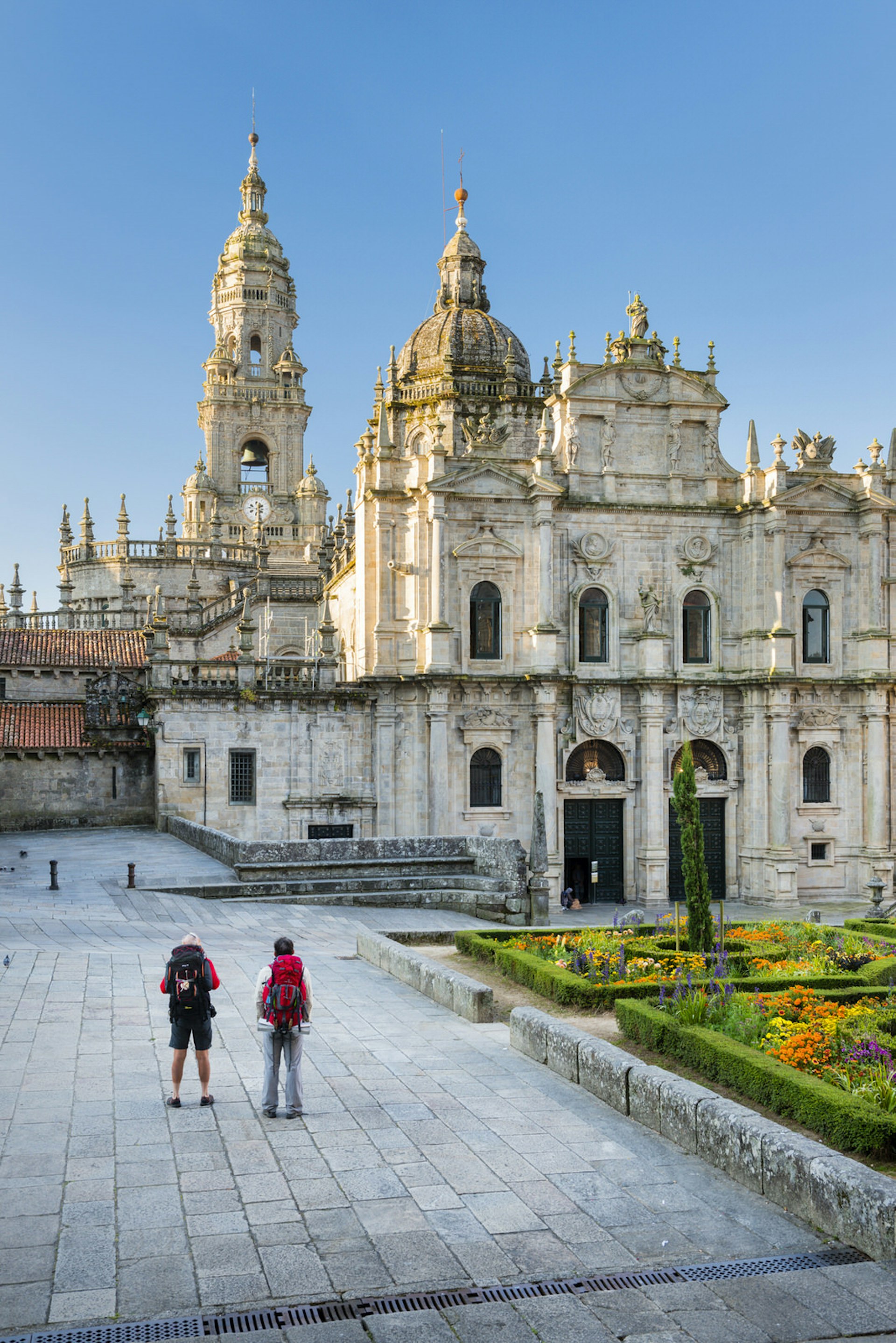 Pilgrims reaching the end of their journey at Santiago de Compostela