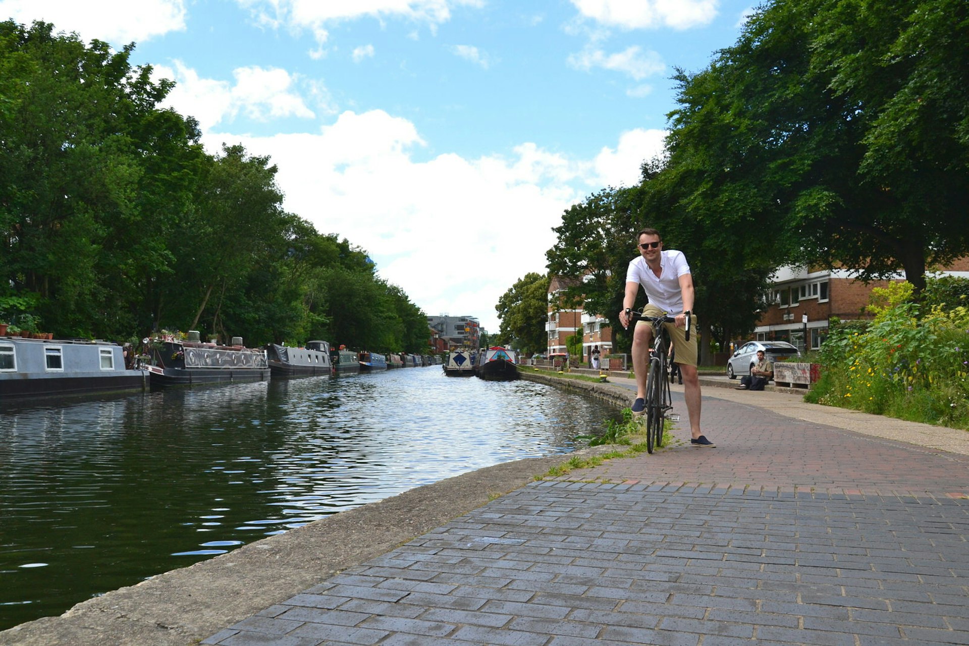 Lonely Planet writer Will Jones on a bike next to Regent's Canal 