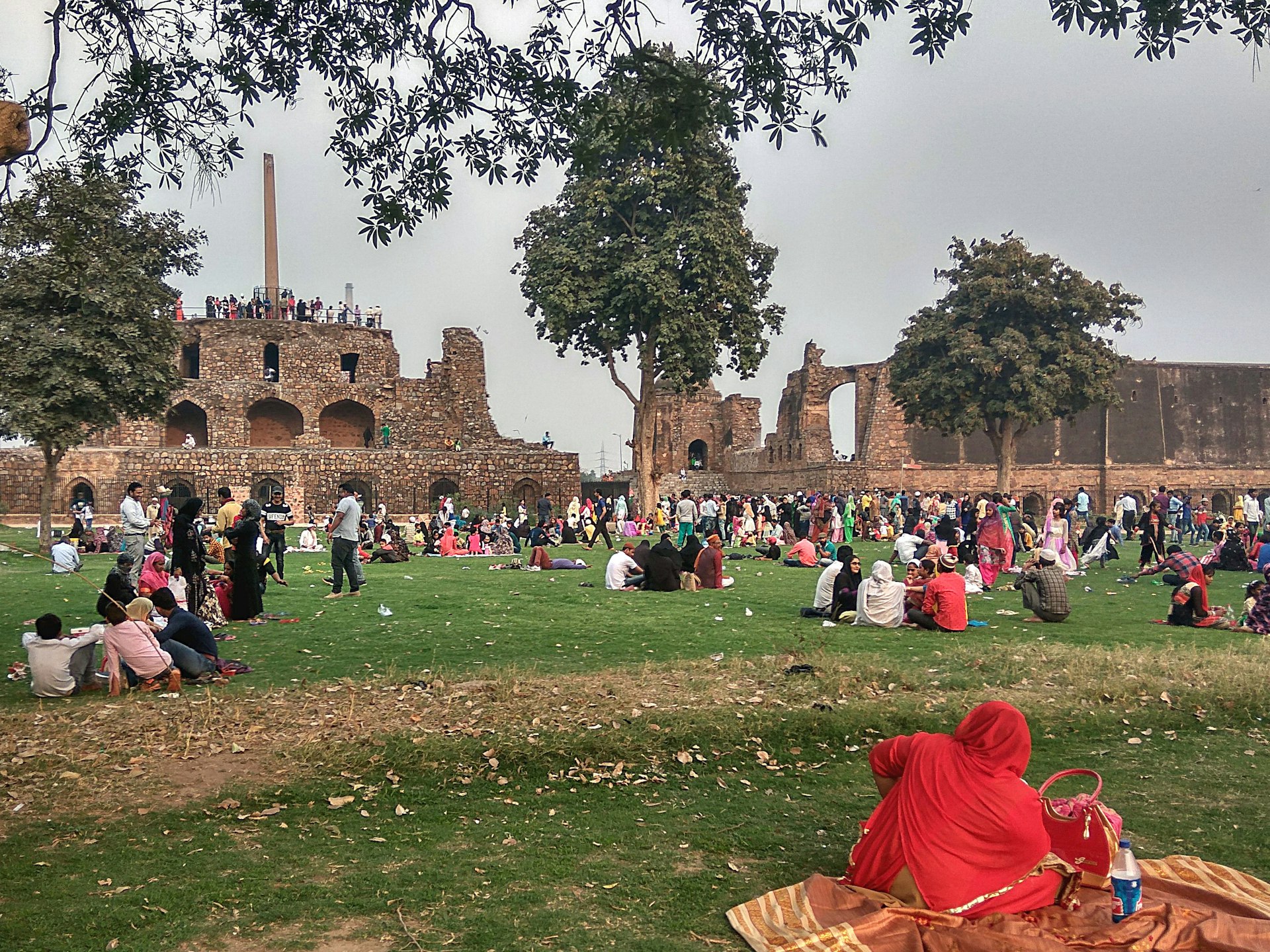 Muslim families picnic in the ruins of Feroz Shah Kolta