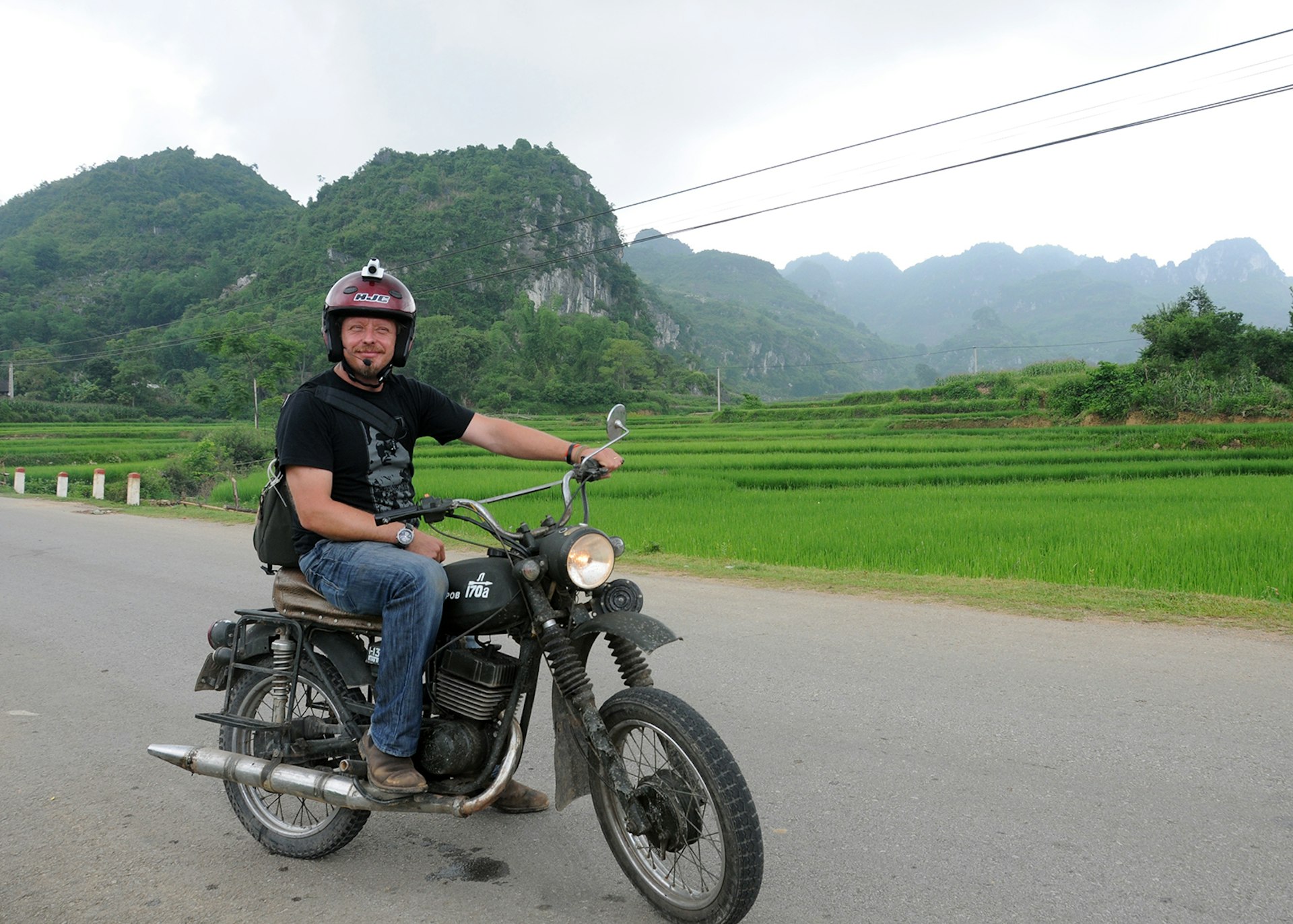 Charley Boorman riding a motorcycle in Vietnam © Charley Boorman