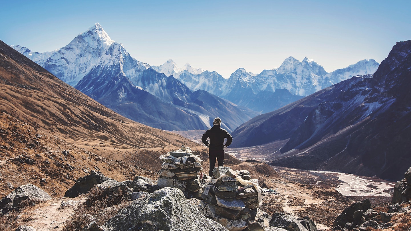 Hiker with mountains in the background in Nepal © Fahad Mohammed / 500px