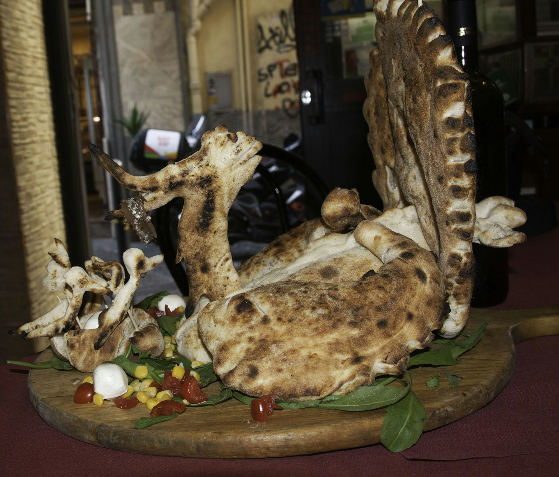 Carmine Mauro's incredible peacock-shaped pizza © Kristin Melia / Lonely Planet
