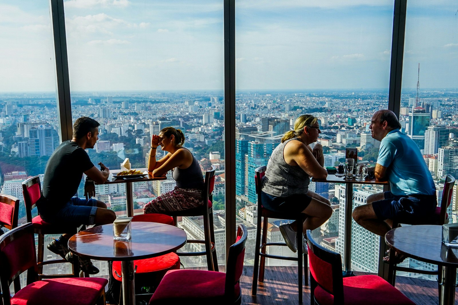 Customers sit by the window at Cafe EON, overlooking expansive views of Ho Chi MInh City below