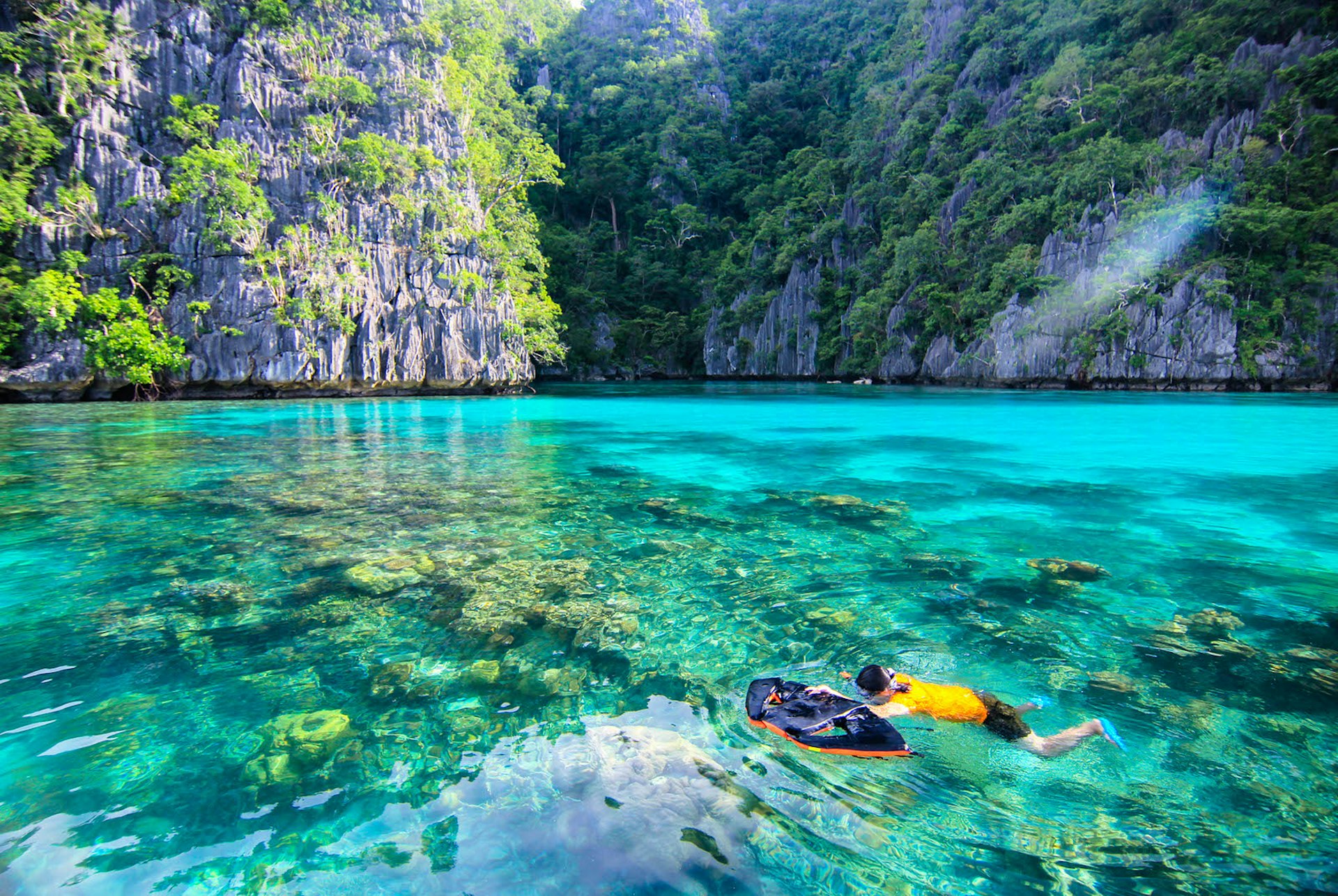 A child snorkels in Palawan, Philippines