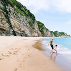 Features - Father and child having fun on beautiful beach, Chiba, Japan