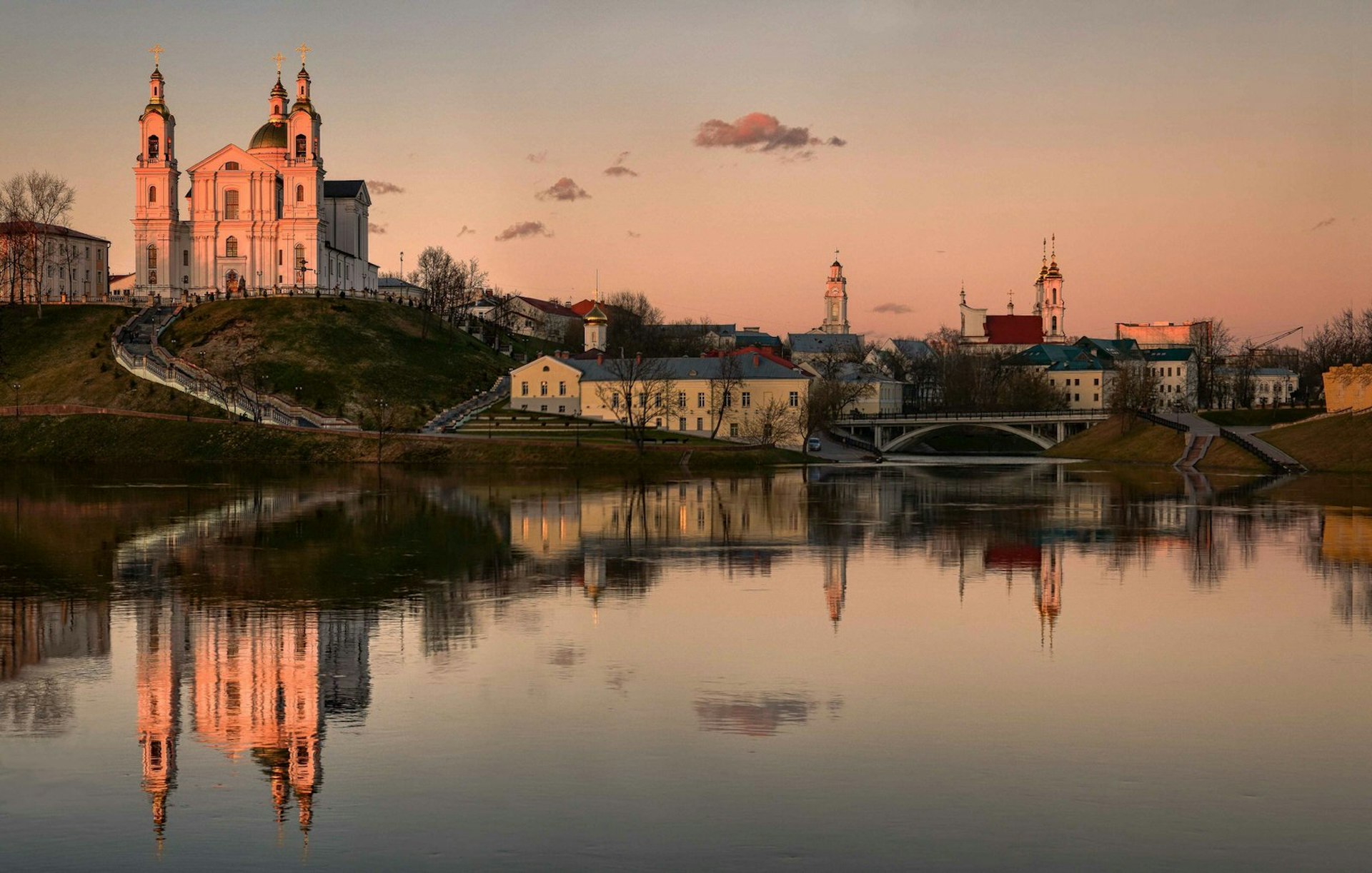 The city of Vitebsk in Belarus reflected in the river at sunset © Kyrill Mukhomedzyanov / 500px 