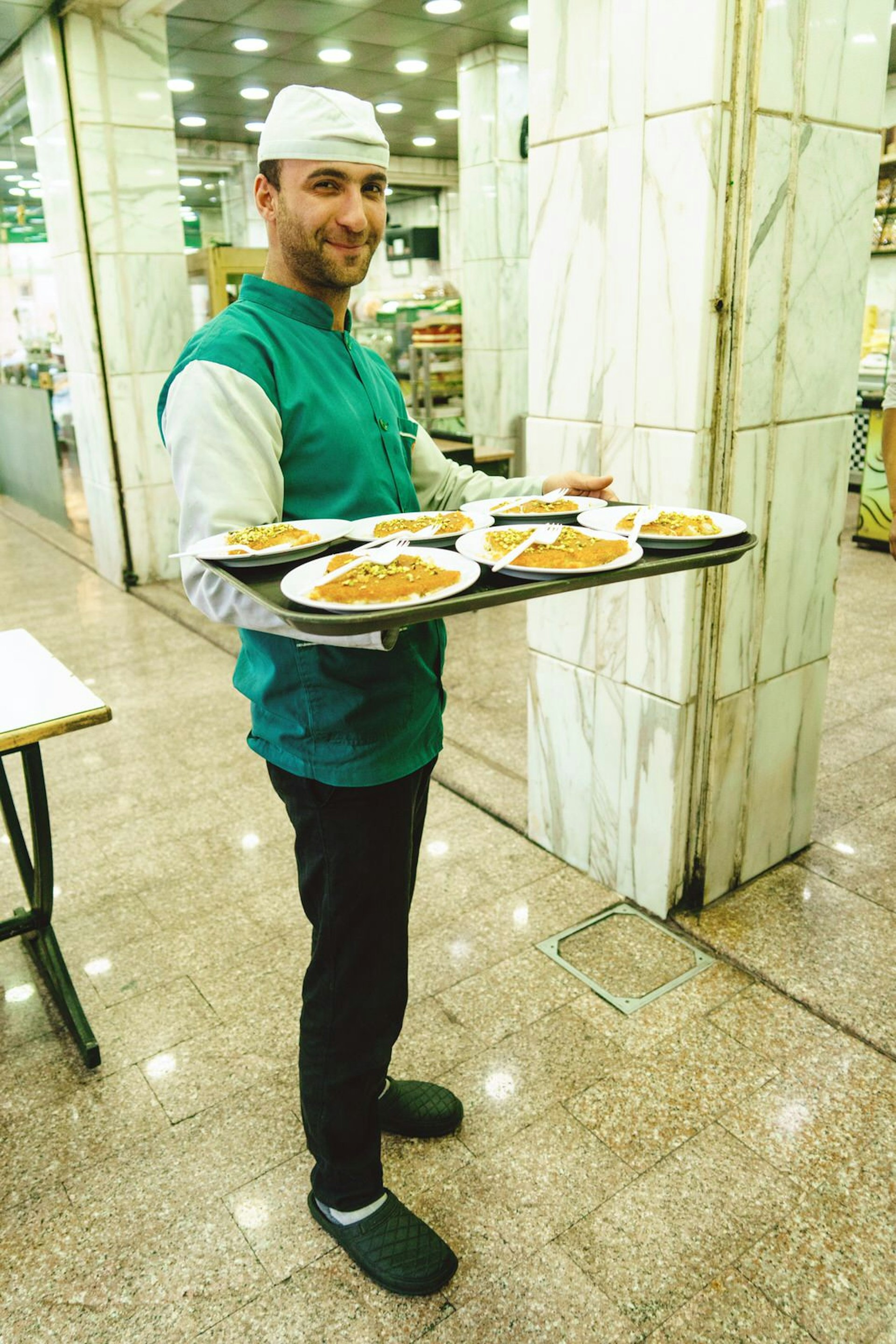 It's mostly locals ordering kunafeh Al Sahel Al Akhdar. Image by Yulia Denisyuk / Lonely Planet