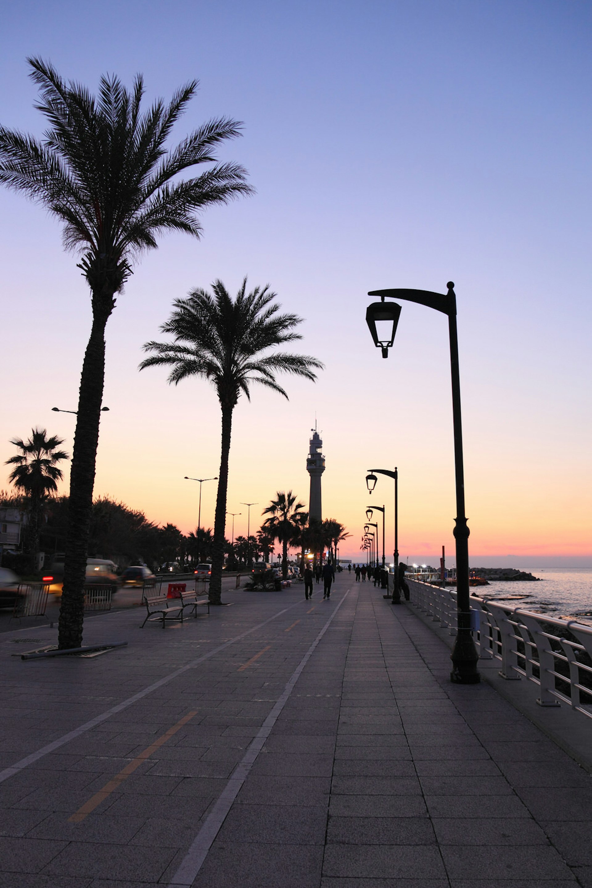 People strolling on the Beirut Corniche at sunset. Image by dkaranouh / Getty
