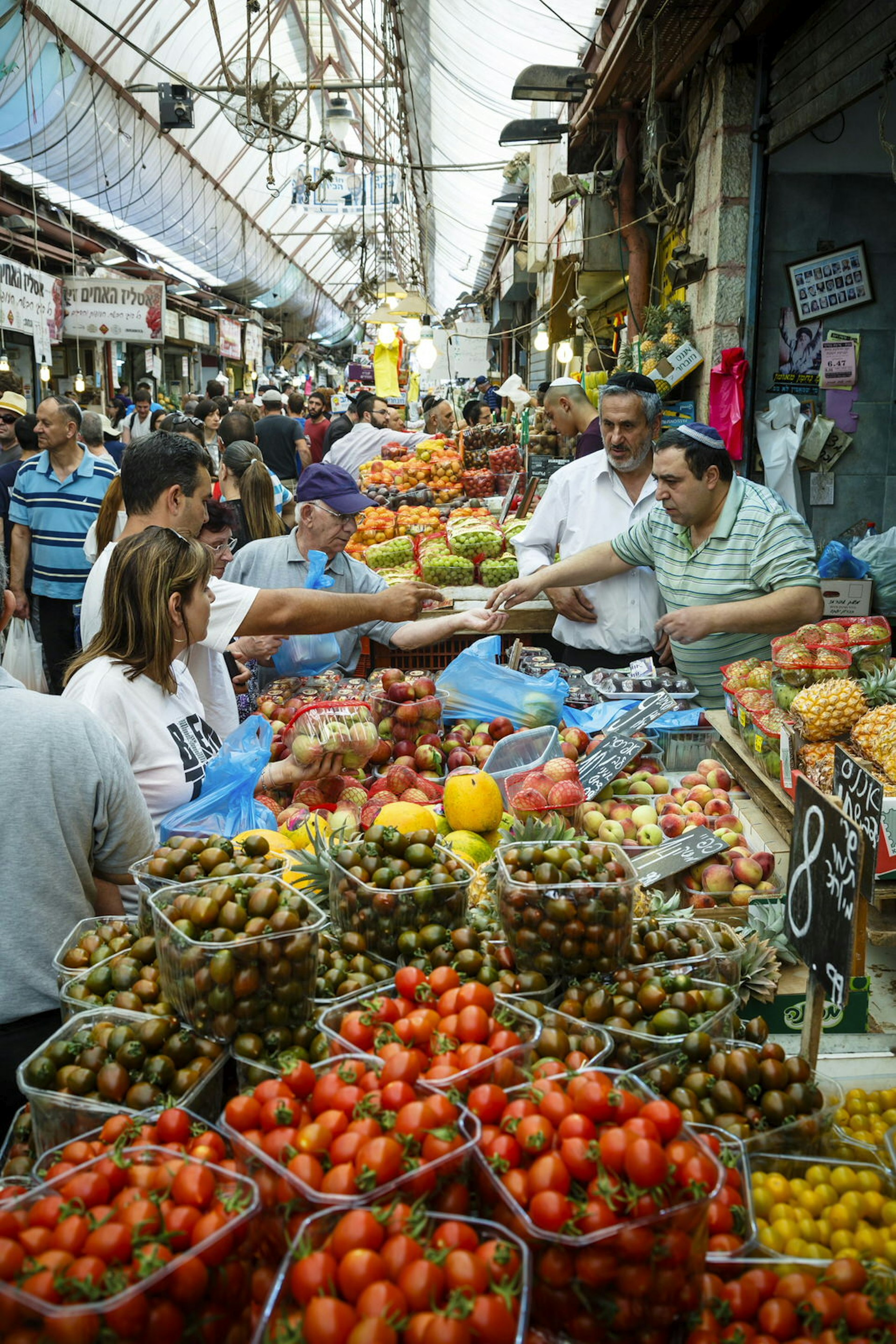 Fruit and vegetable stalls at Jerusalem's Mahane Yehuda Market. Image by Yadid Levy / robertharding / Getty