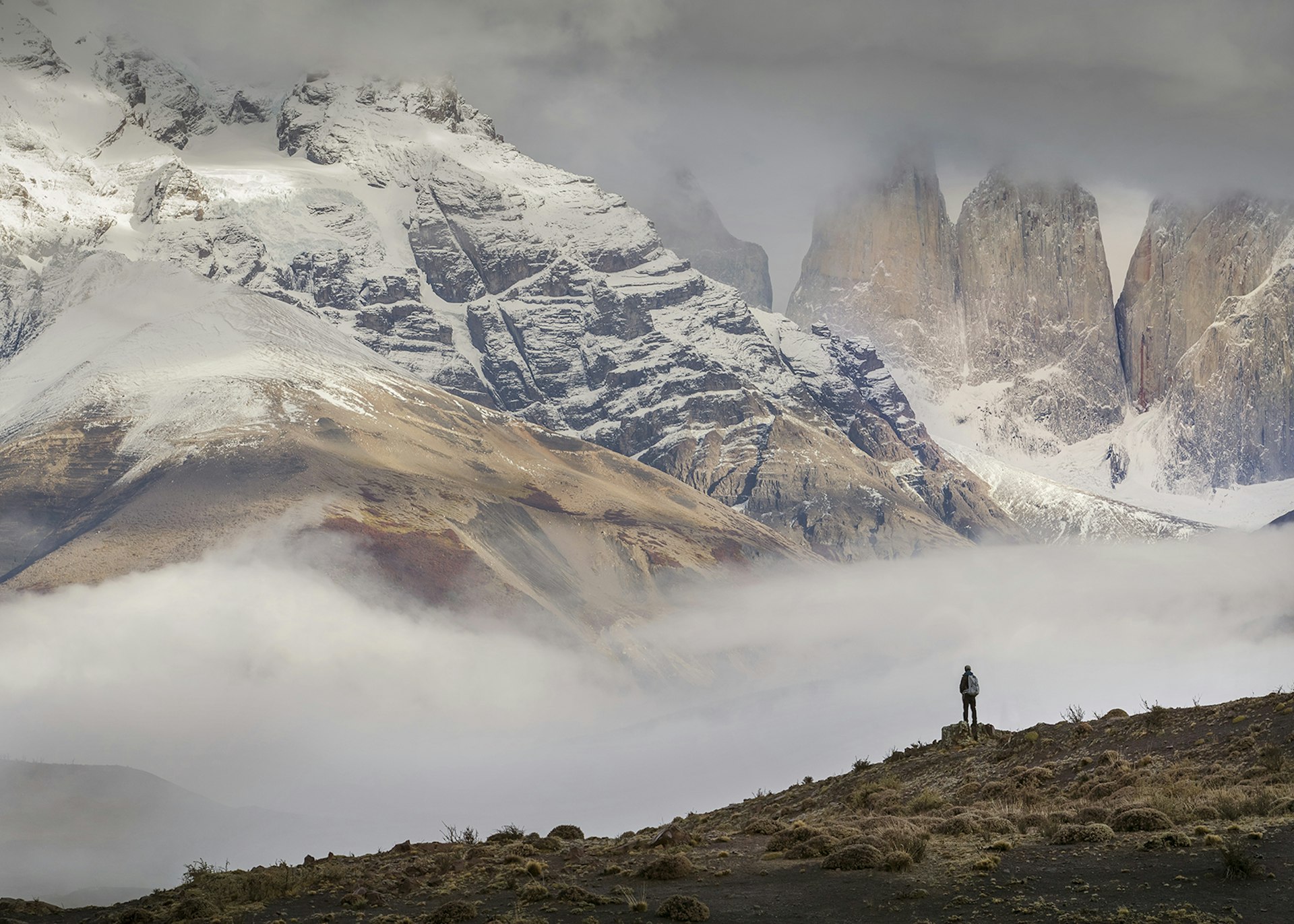 A hiker in front of the Torres del Paine mountain range, Chilean Patagonia © Philip Lee Harvey / Lonely Planet