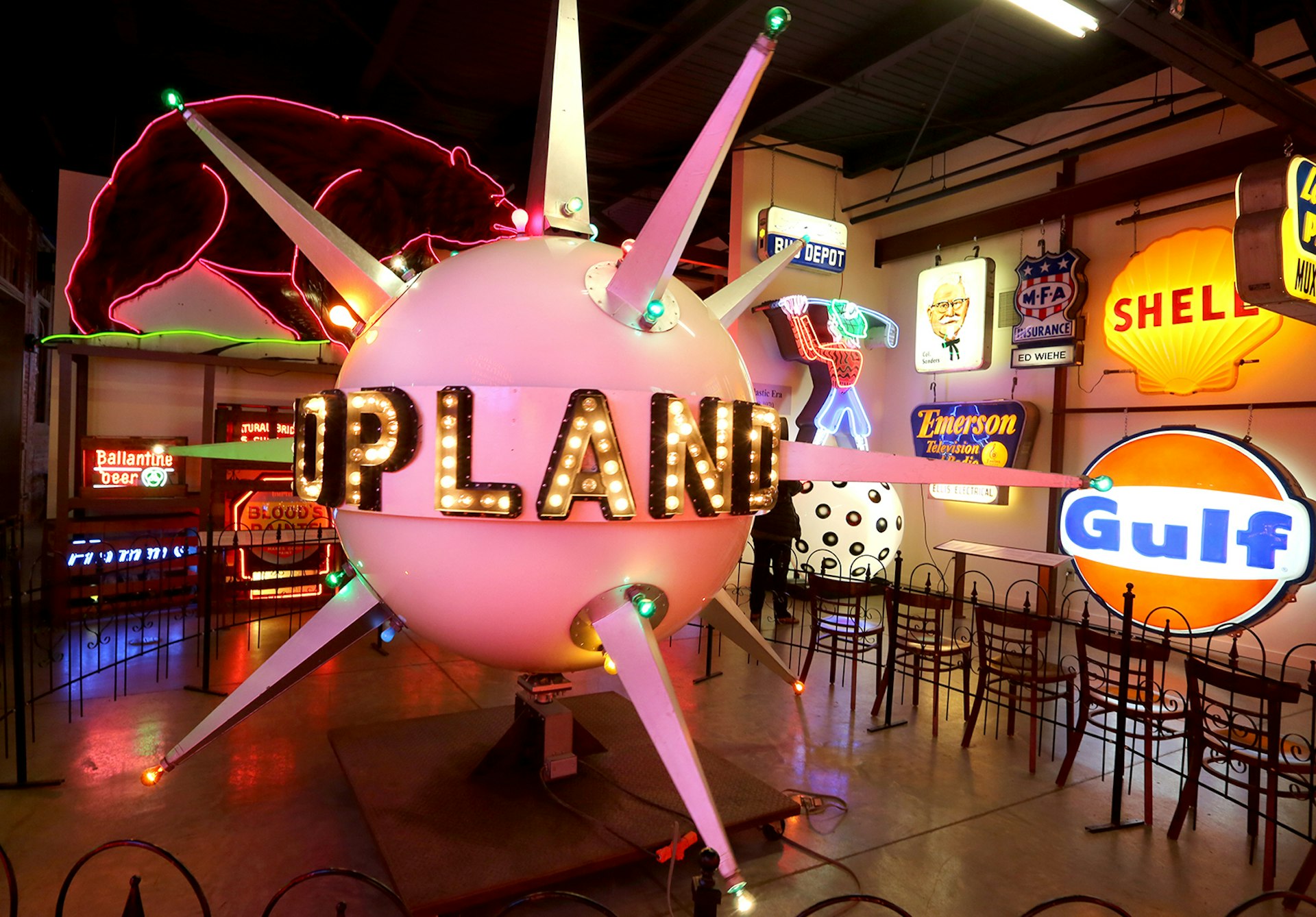 a pink, spiky neon sign takes center stage at the American Sign Museum