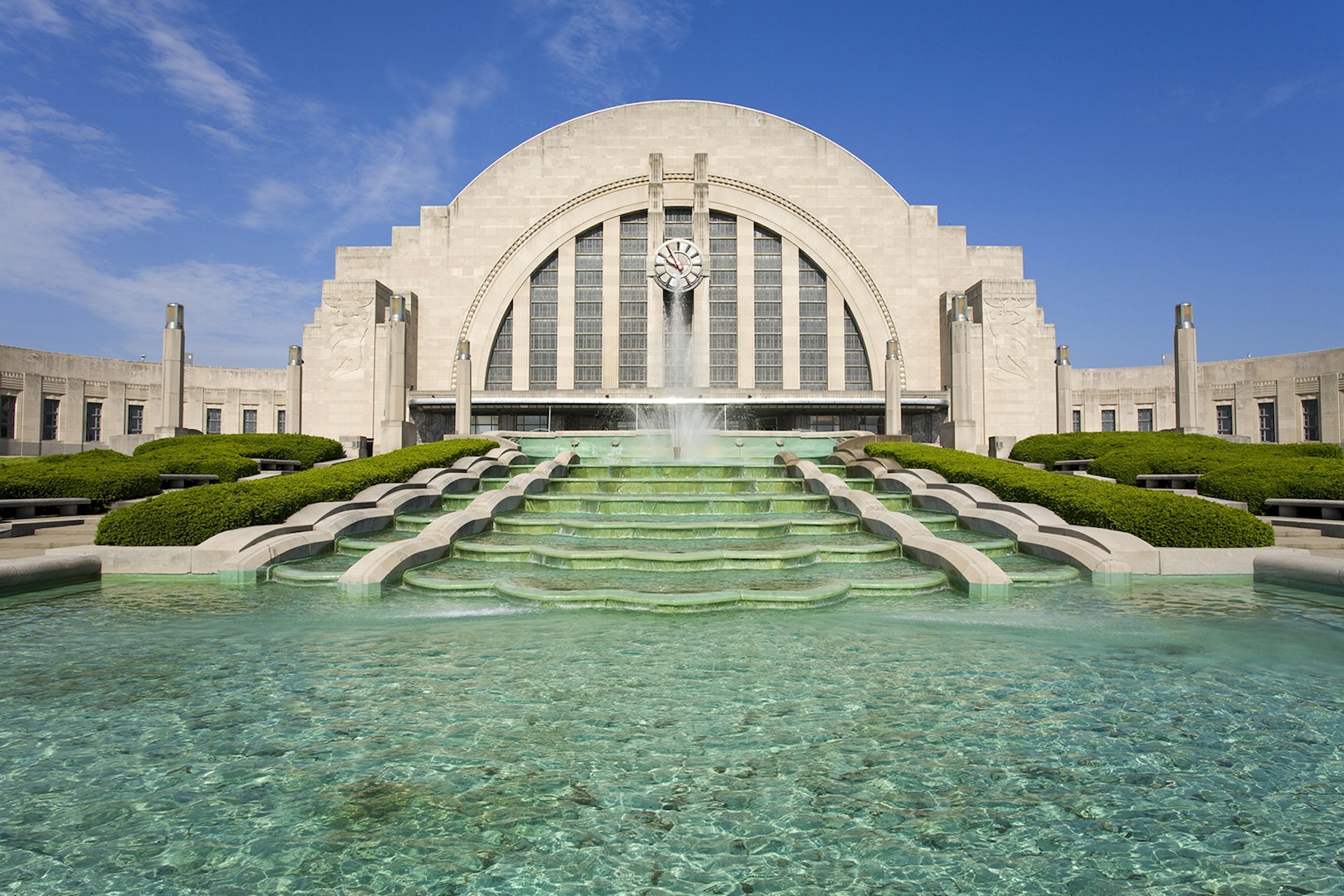 a terraced fountain flows from the front of an art deco railway terminal in Cincinnati