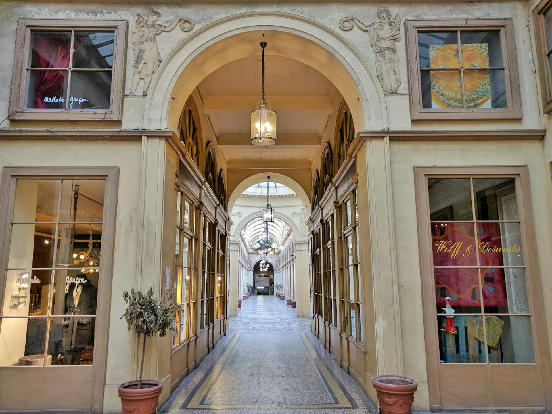 An empty corridor of the ornate Galerie Vivienne in Paris
