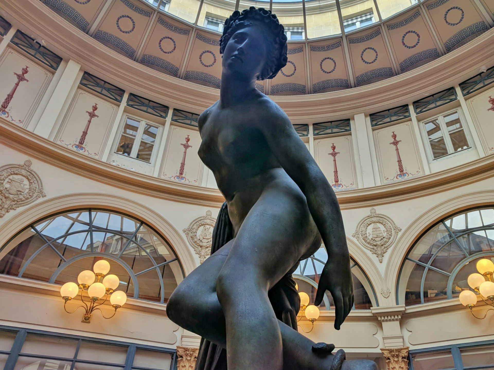 A statue of Eurydice being bitten by a snake in the rotunda of the Galerie Colbert