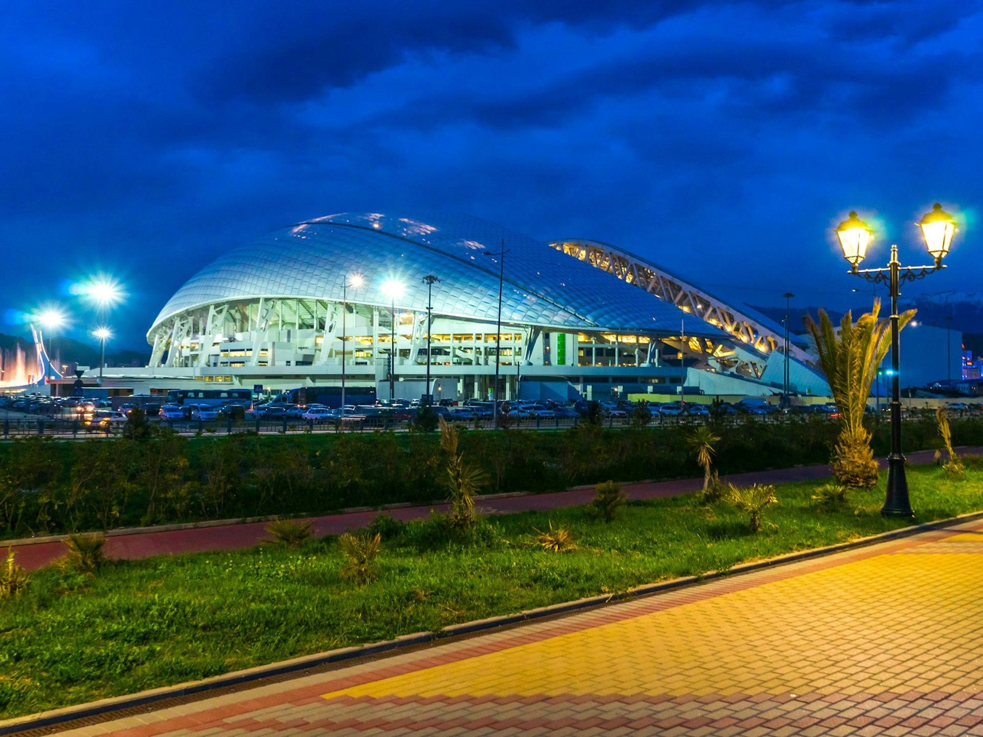 The open-air Fisht football stadium in Sochi’s former Olympic Park, aglow at sunset © den781 / Shutterstock