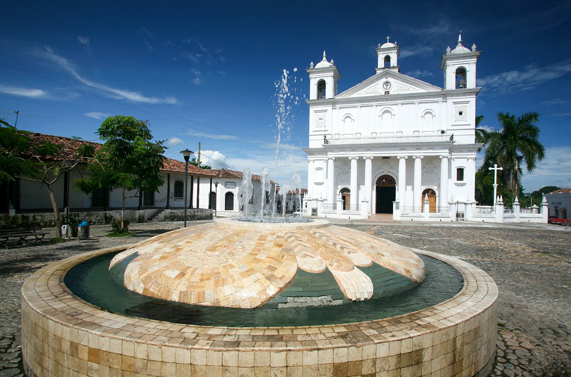 Features - Iglesia Santa Lucia as seen from Parque Centenario fountain.