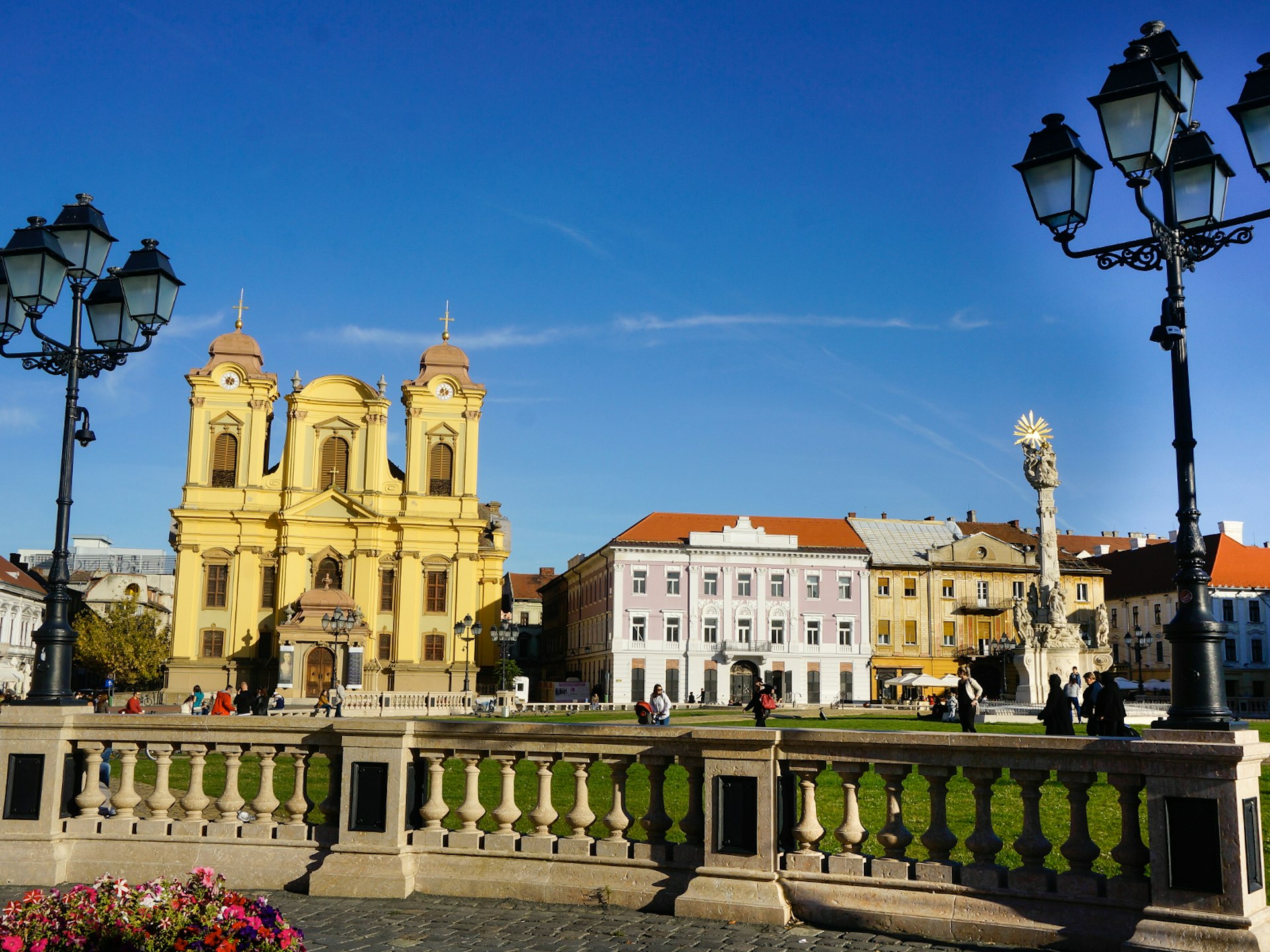 The baroque Roman Catholic Cathedral adorns Timișoara’s colourful Union Square © Monica Suma / Lonely Planet