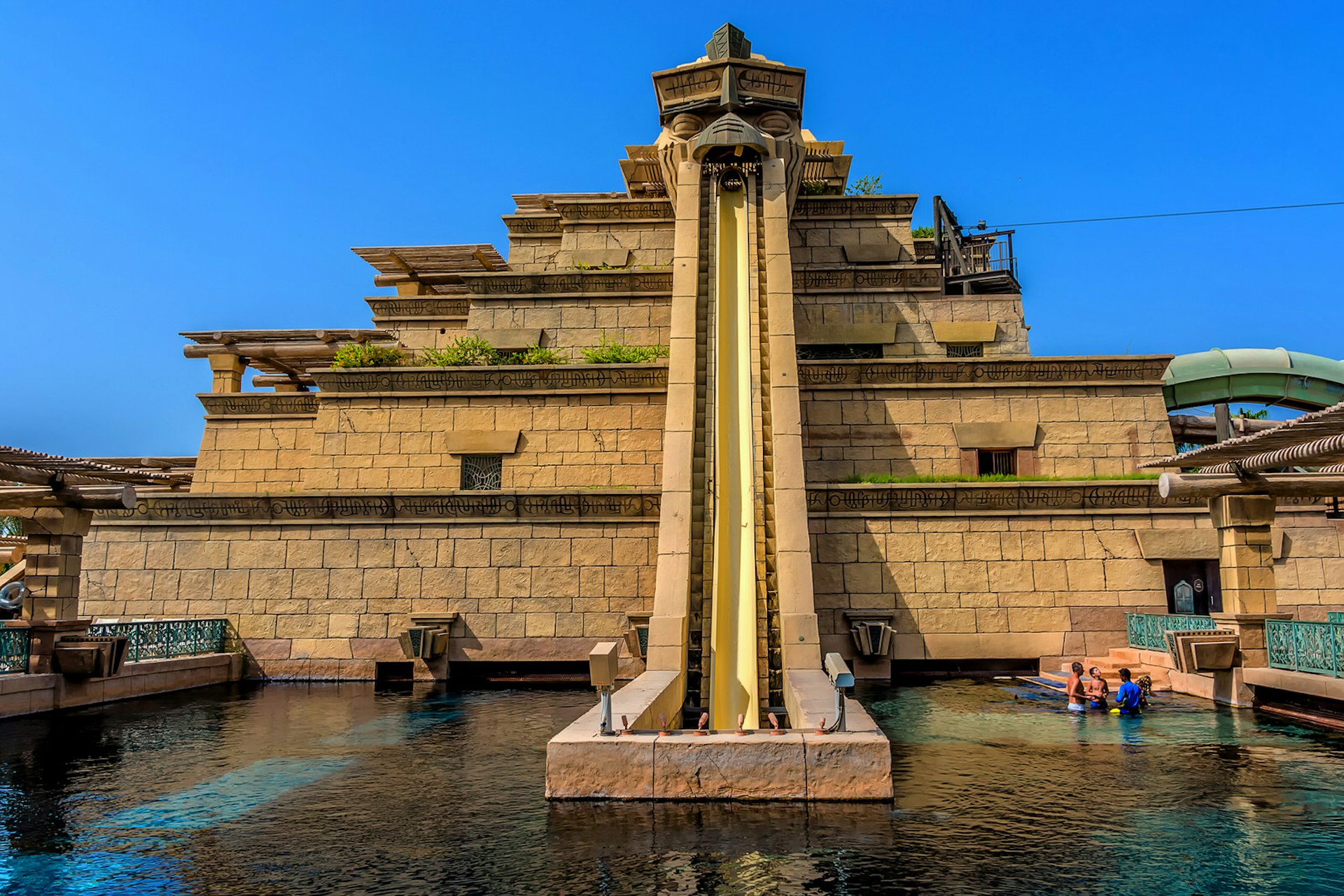 The Aquaventure waterpark of Atlantis the Palm hotel, located on man-made island Palm Jumeirah. The Tower Of Neptune. Image by Kiev.Victor / Shutterstock
